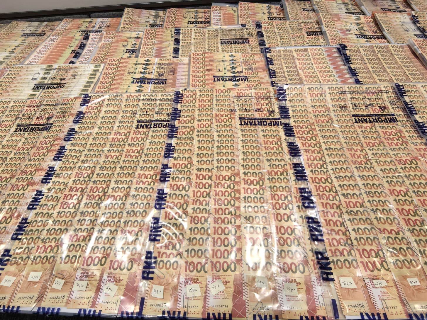 Hong Kong police seized HK$1.6 million in cash during a raid on the syndicate’s premises in Tsuen Wan. Photo: Handout