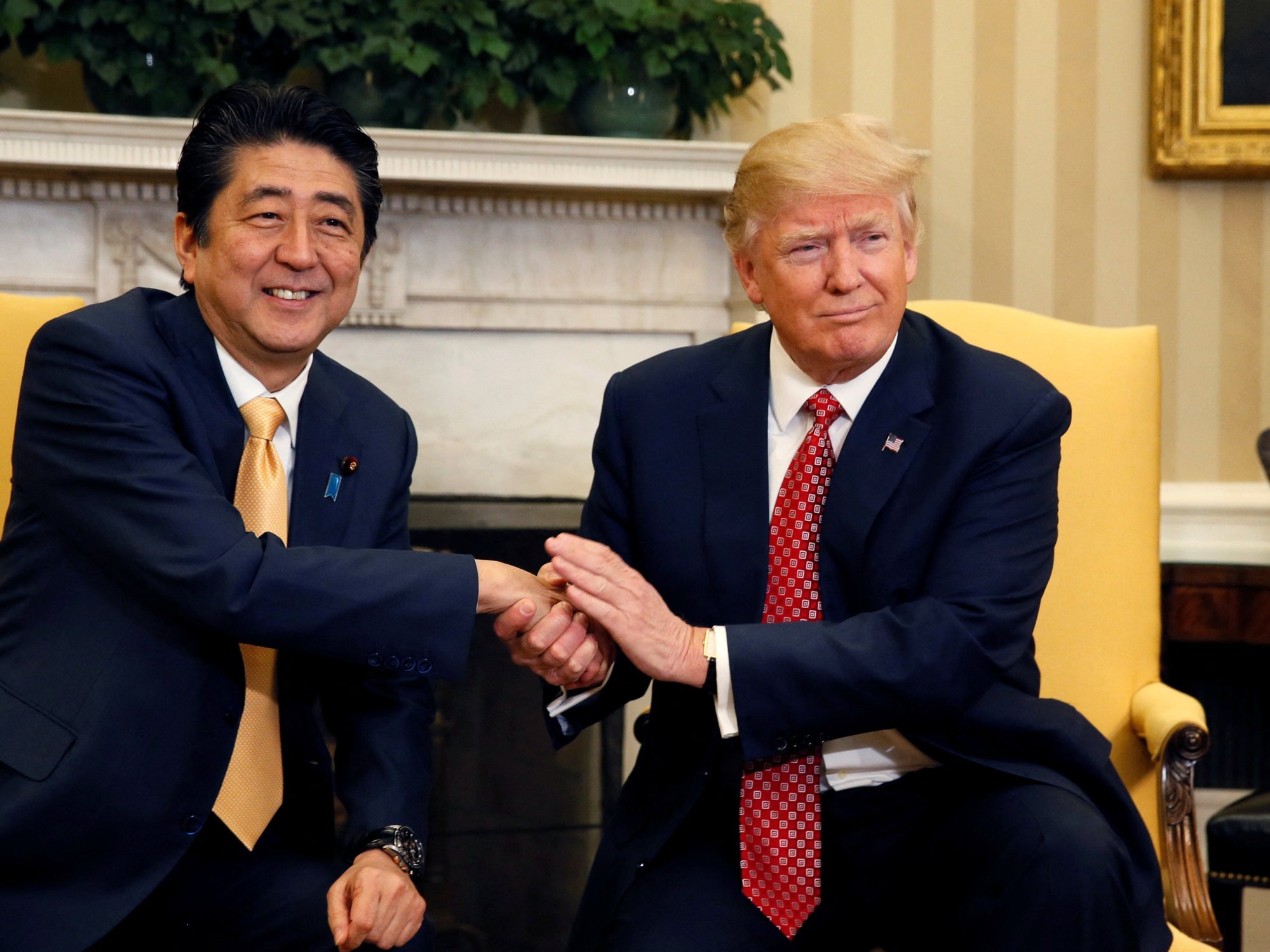 Japan’s former prime minister, the late Shinzo Abe, shakes hands with US President Donald Trump at the White House in 2017. Photo: Reuters Japan’s former prime minister, the late Shinzo Abe, shakes hands with US President Donald Trump at the White House in 2017. Photo: Reuters