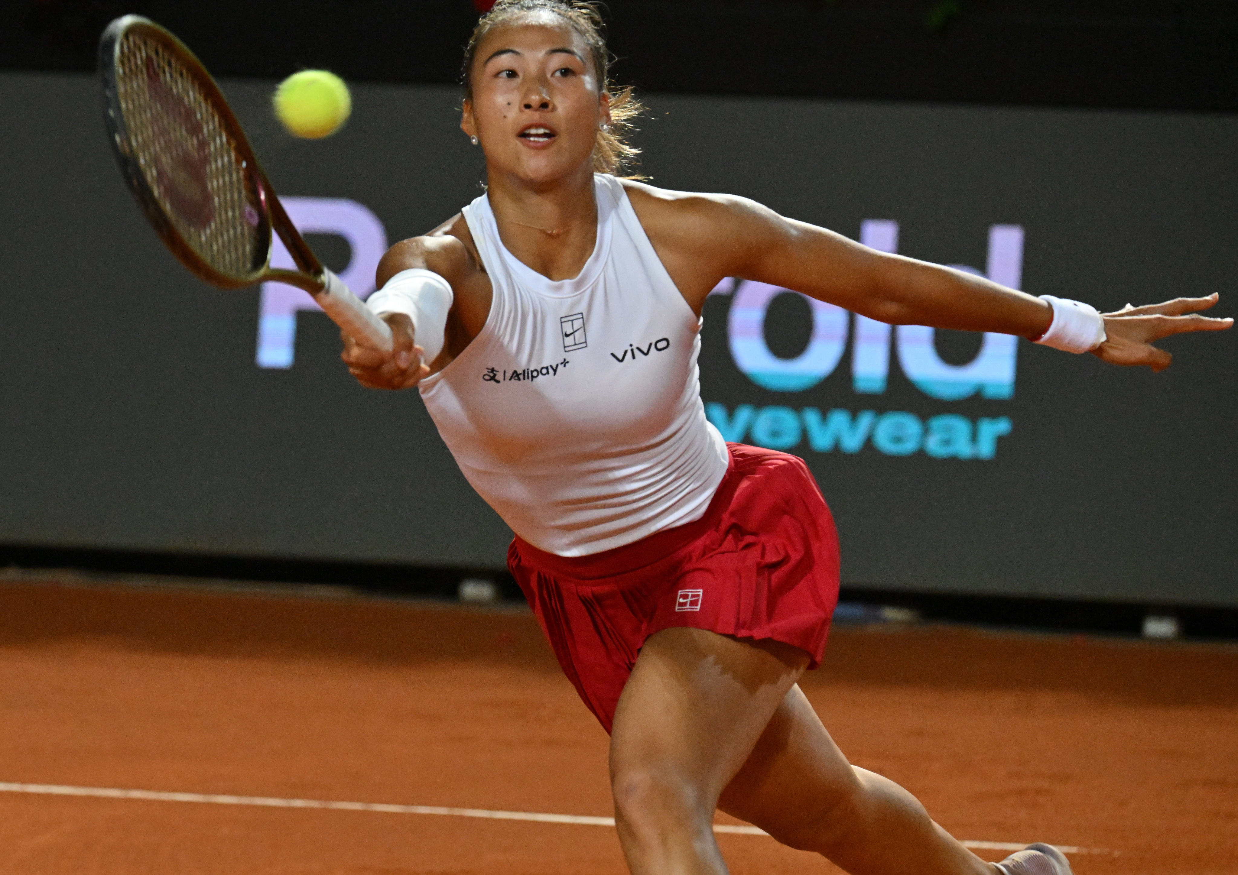 Zheng Qinwen makes a return during her Italian Open semi-final defeat by Coco Gauff. Photo: Xinhua