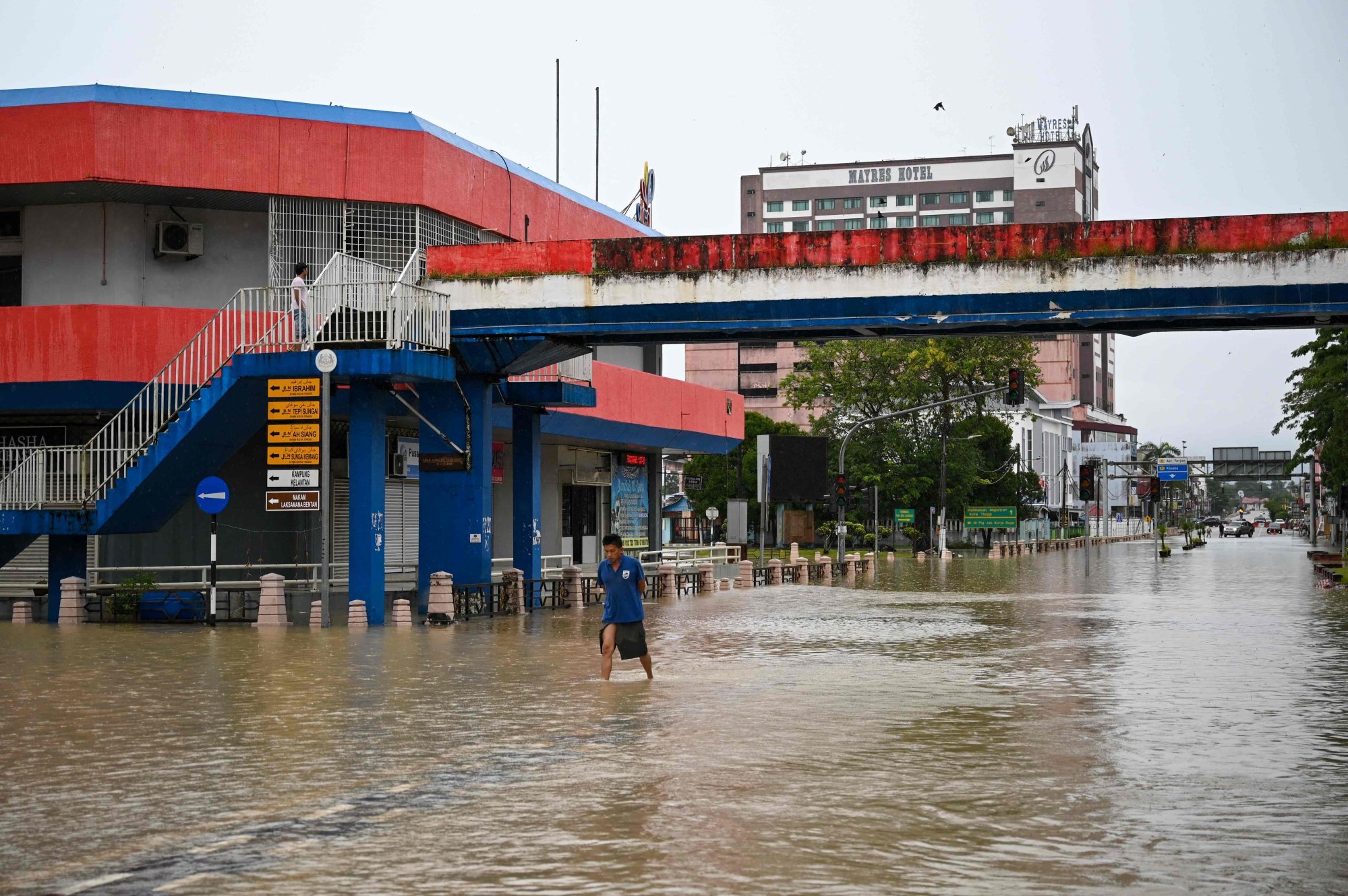 A man wades through flood waters in Malaysia’s Johor state in 2023. Photo: AFP A man wades through flood waters in Malaysia’s Johor state in 2023. Photo: AFP