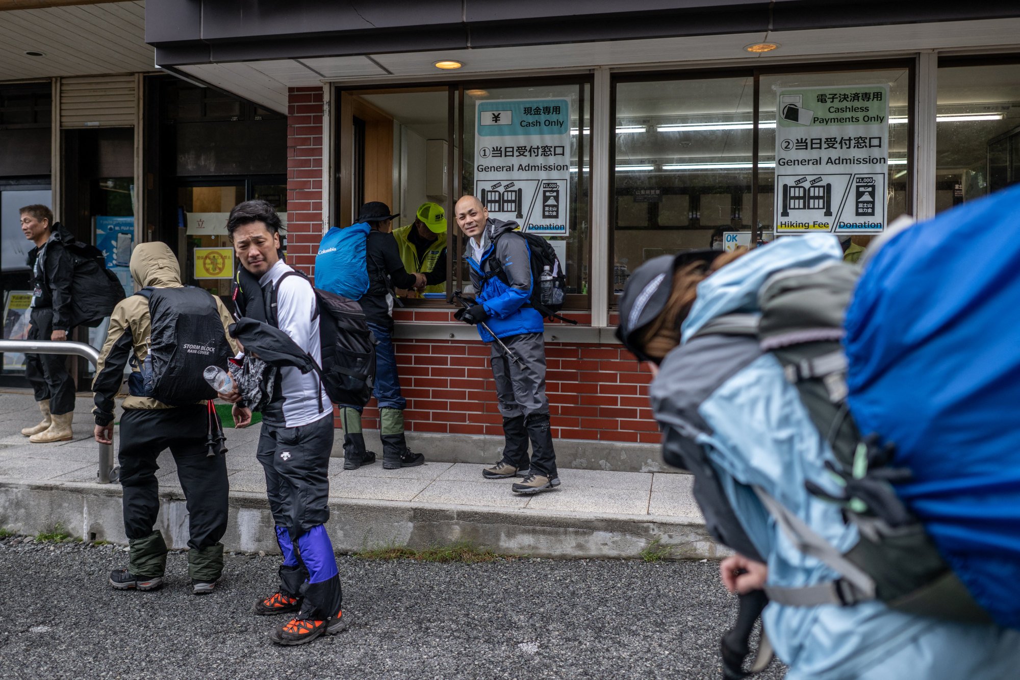 Hikers pay a hiking fee to climb Mount Fuji via the Yoshida trail. Photo: AFP Hikers pay a hiking fee to climb Mount Fuji via the Yoshida trail. Photo: AFP