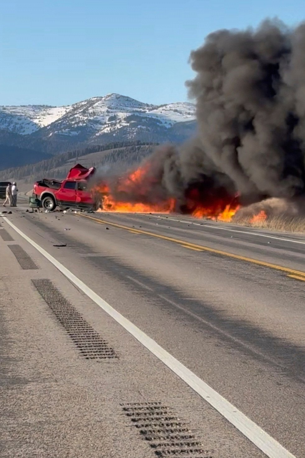 Rescuers at the scene of a deadly collision between a pickup truck and tour van near Henry’s Lake State Park in eastern Idaho on May 1. Photo: AP