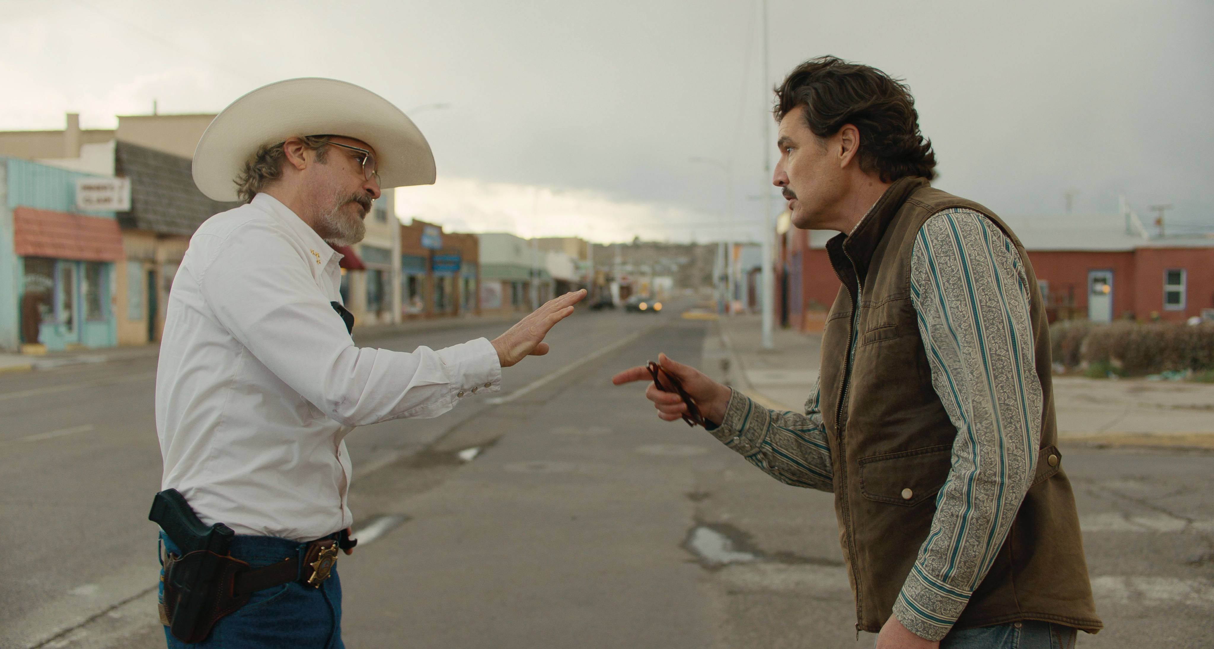 Joaquin Phoenix (left) as Sheriff Joe Cross and Pedro Pascal as Mayor Ted Garcia in a still from Eddington, directed by Ari Aster. Emma Stone co-stars