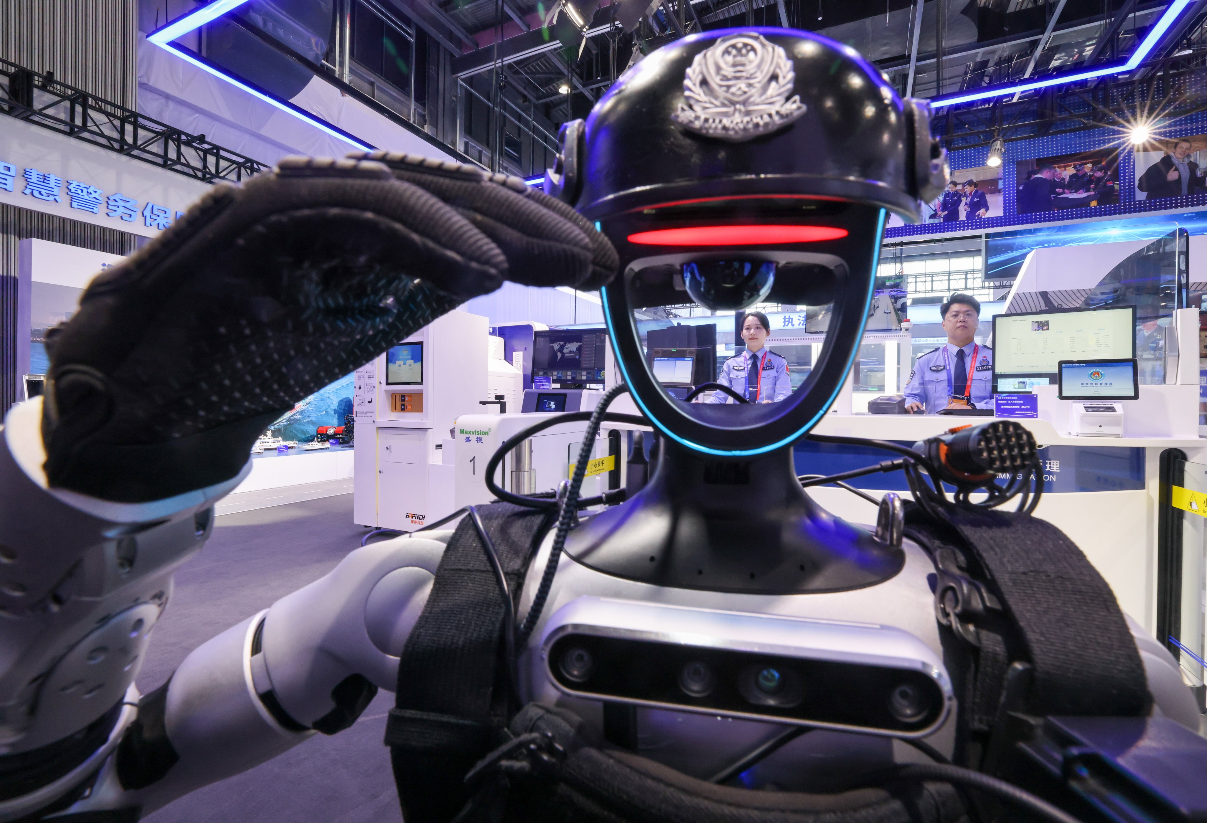 A humanoid police robot salutes during the 12th China International Exhibition on Police Equipment in Beijing, China on Wednesday. Photo: Xinhua