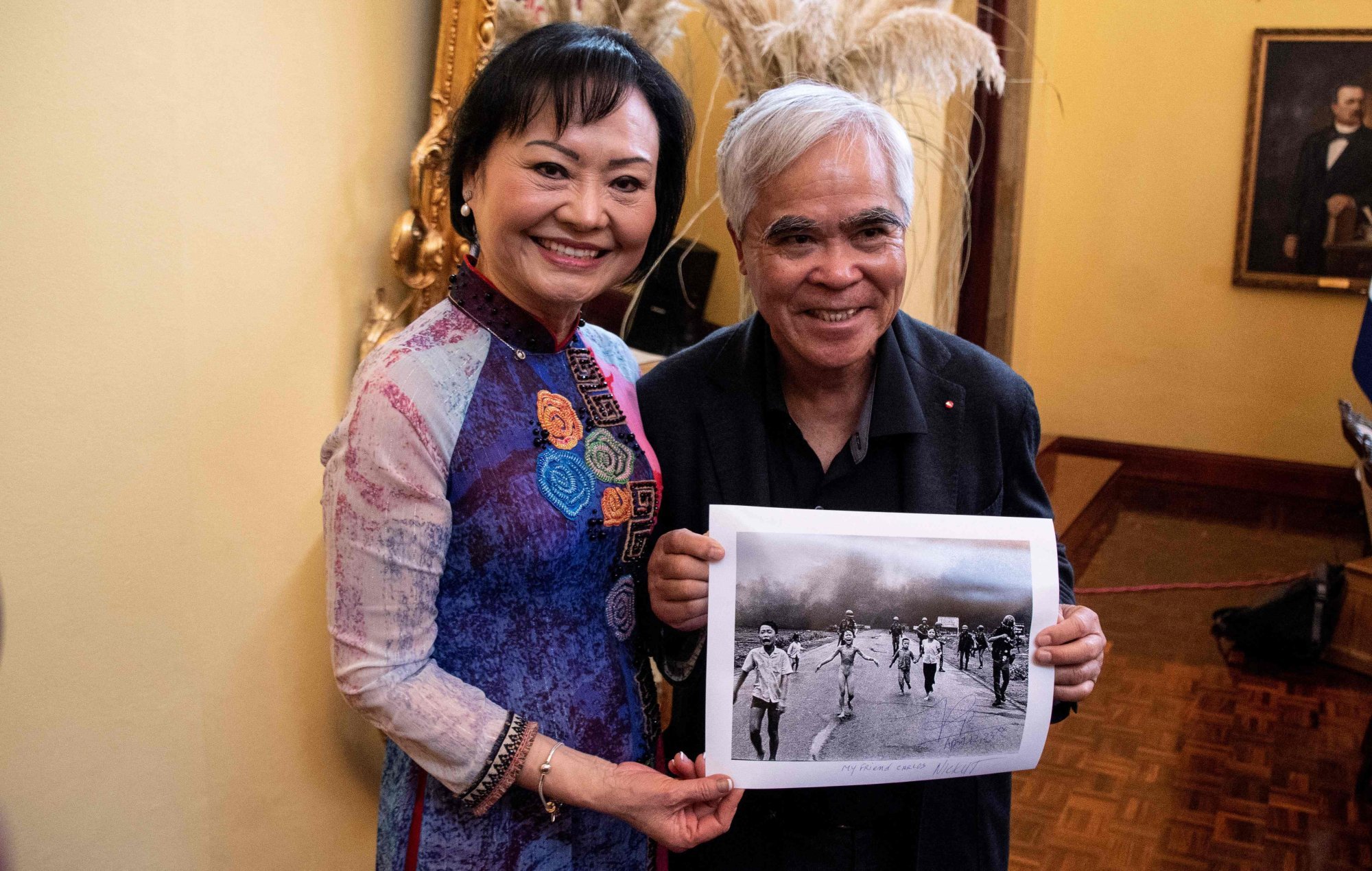 Vietnam war survivor Kim Phuc, also known as the “Napalm Girl”, poses with photojournalist Nick Ut holding the award-winning photograph in April 2023. Photo: AFP Vietnam war survivor Kim Phuc, also known as the “Napalm Girl”, poses with photojournalist Nick Ut holding the award-winning photograph in April 2023. Photo: AFP