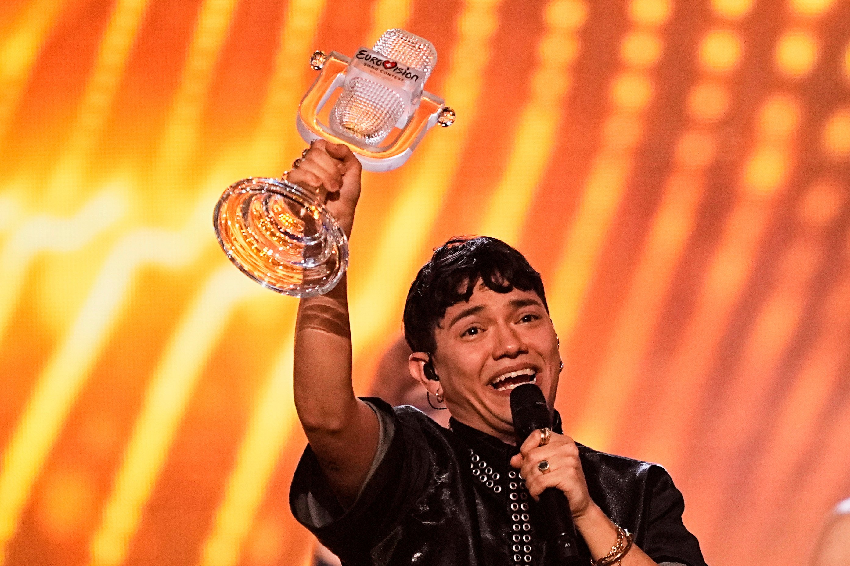 JJ from Austria holds up the Eurovision trophy he won with the song “Wasted Love” in Basel, Switzerland, on Saturday. Photo: AP