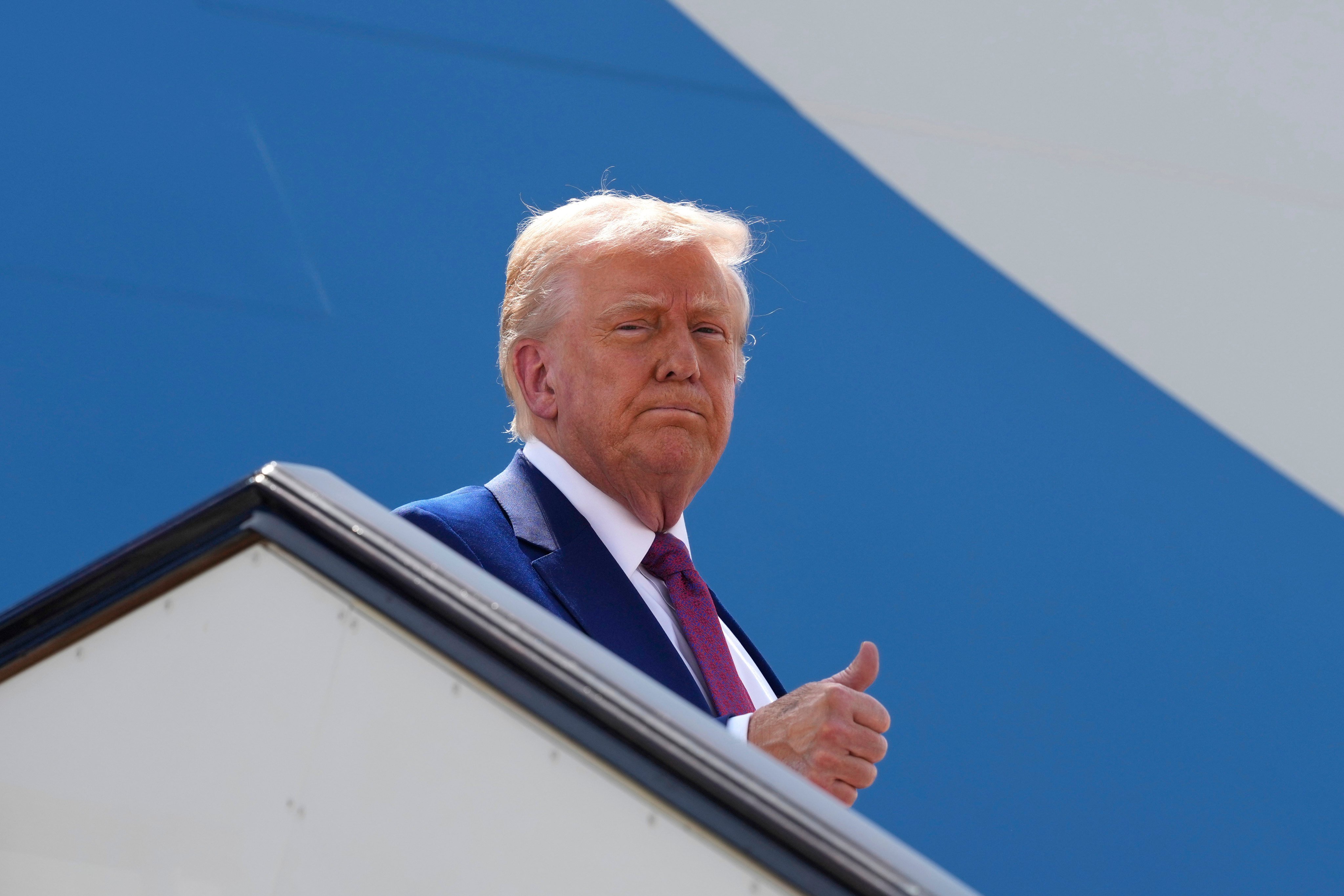 US President Donald Trump gestures as he boards Air Force One on Thursday. Photo: AP