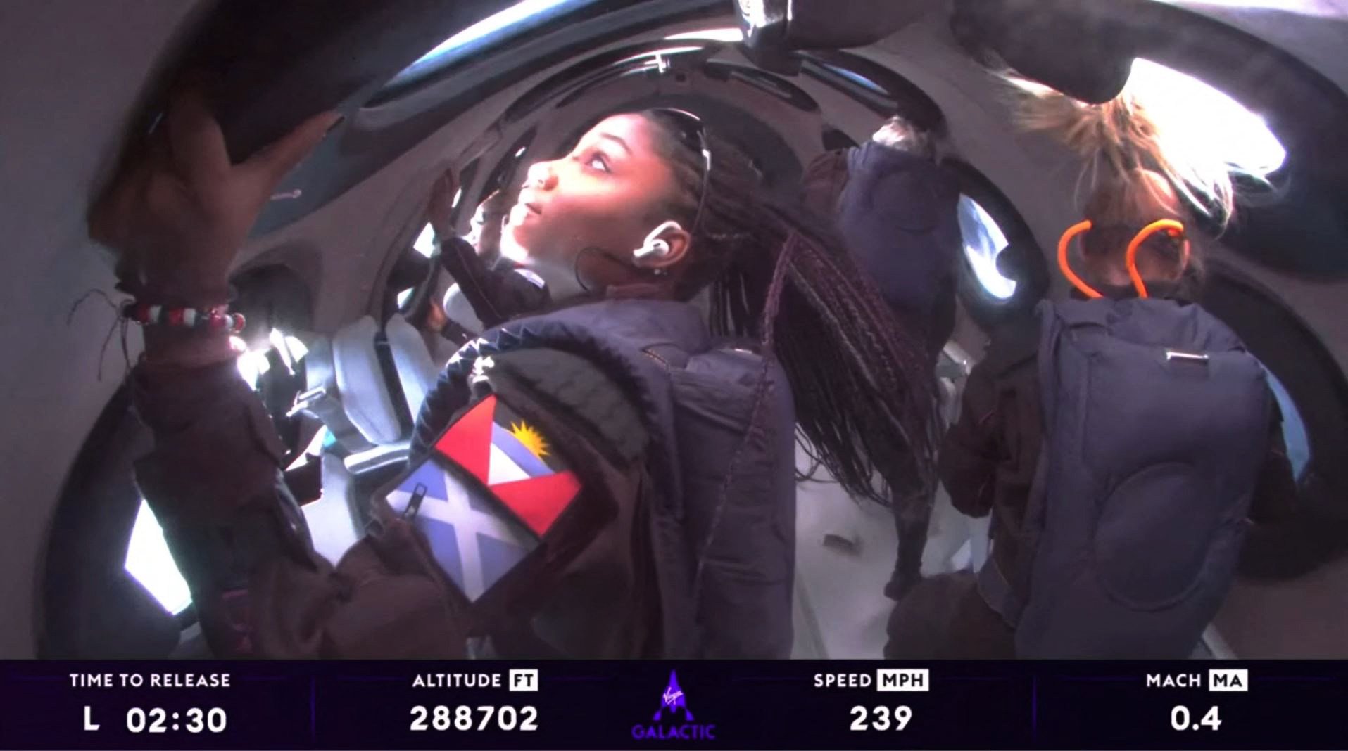 A still from a video from Virgin Galactic on August 10, 2023, with Anastatia Mayers (front left), 18, Jon Goodwin (back right), 80, and Chief Astronaut Instructor Beth Moses (front right) in space. Virgin Galactic had been selling seats on its forthcoming Delta spacecraft at about US$600,000 a seat. In 2026, it plans to charge more. Photo: Virgin Galactic/AFP
