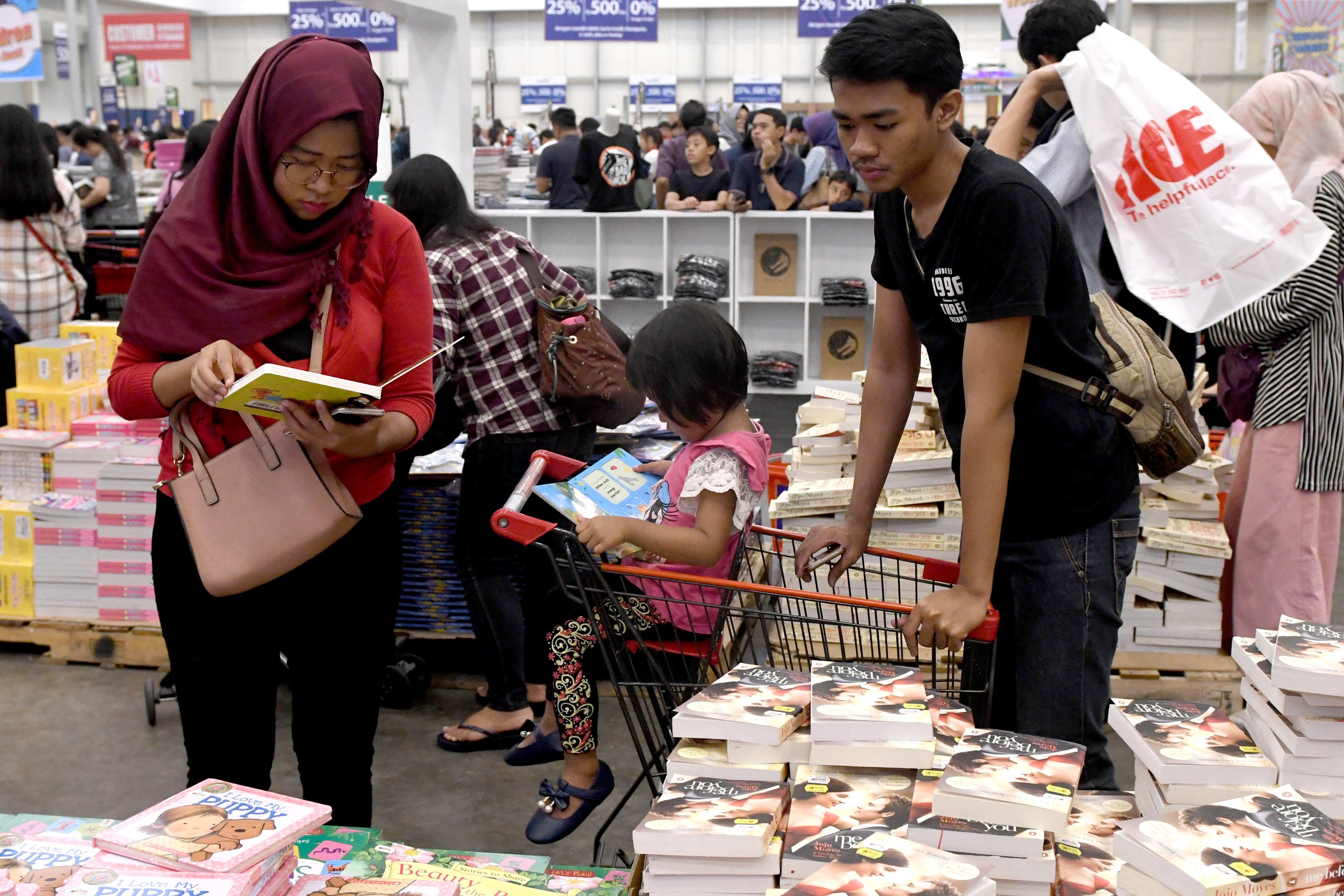 An Indonesian family browsing at a book fair in the suburbs of Jakarta. Photo: AFP