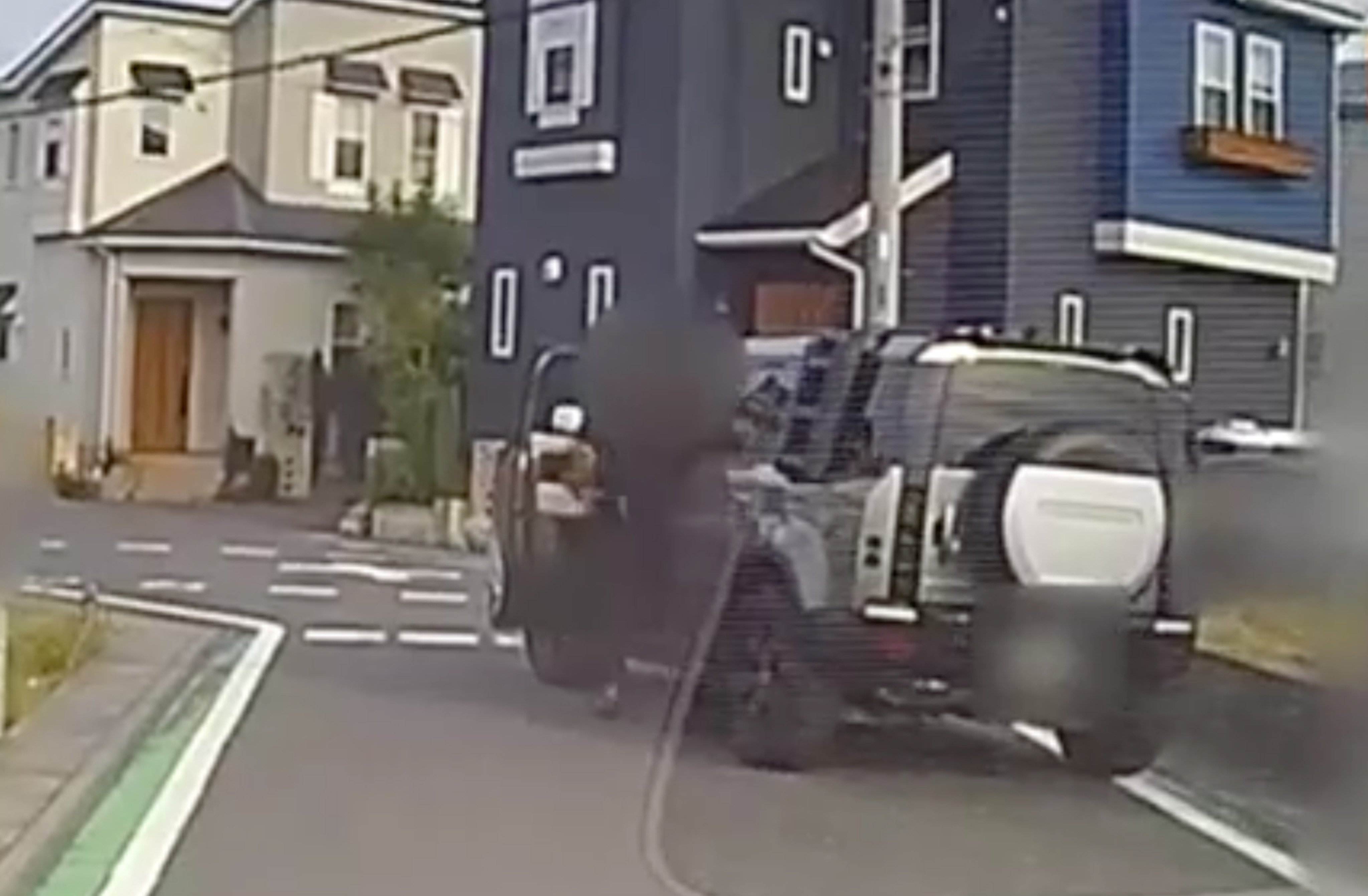 A screen capture from dashcam footage of another car shows the SUV driving away from the scene after allegedly hitting a group of pupils in Misato city in Japan. Photo: Handout