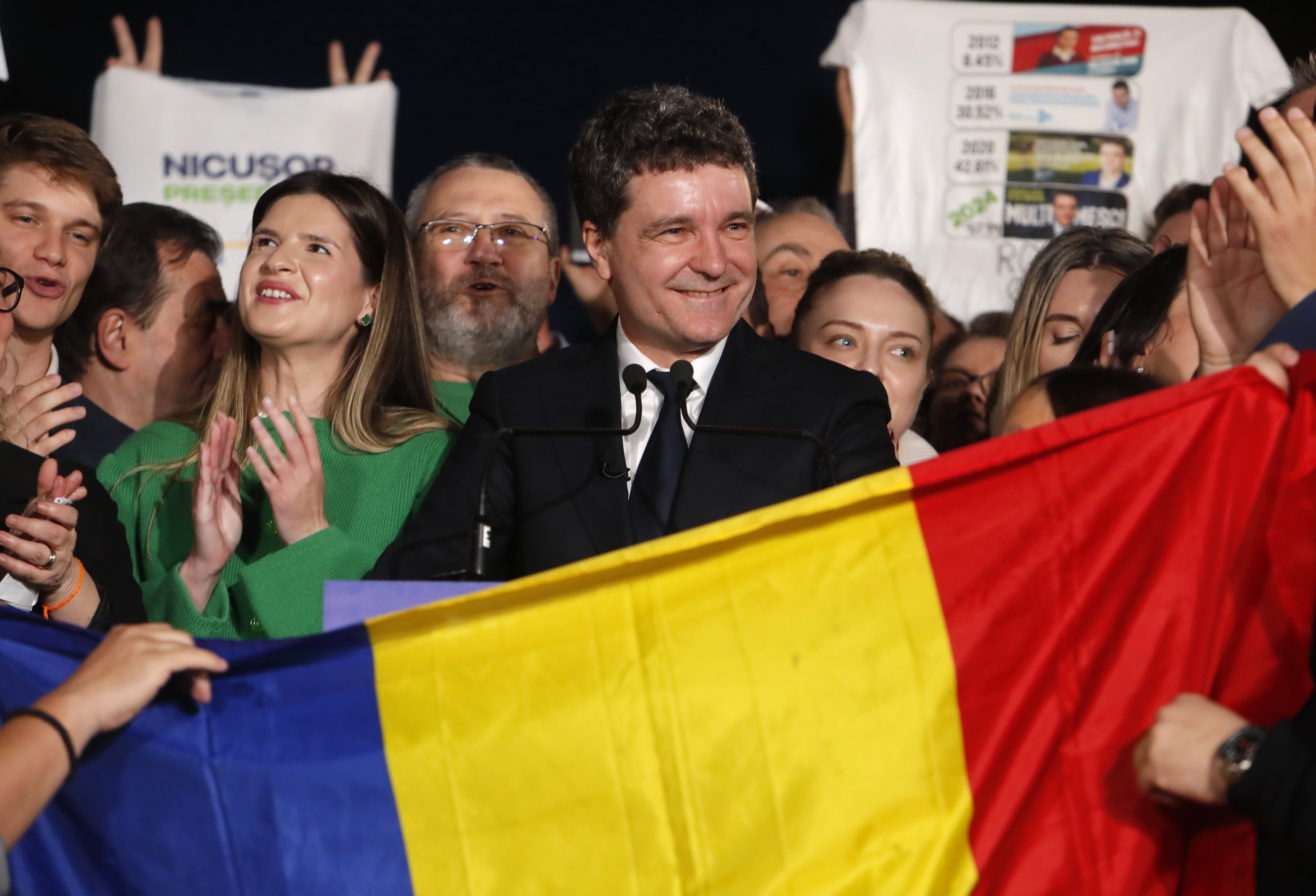 Nicusor Dan, centre, Bucharest mayor and independent presidential candidate supported by the Force of the Right (FD), delivers his speech after the first exit poll results are announced in Cismigiu Park, Bucharest, Romania on Sunday. Photo: EPA-EFE