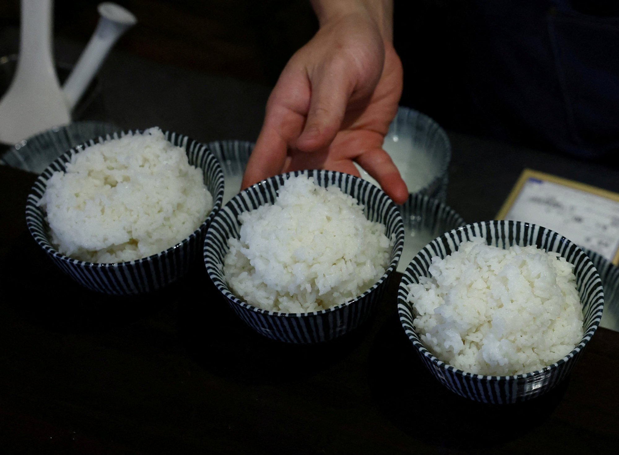 A chef prepares bowls of cooked rice for customers at a restaurant in Tokyo. Retail prices for Japan’s staple grain are about double what they were a year ago. Photo: Reuters A chef prepares bowls of cooked rice for customers at a restaurant in Tokyo. Retail prices for Japan’s staple grain are about double what they were a year ago. Photo: Reuters