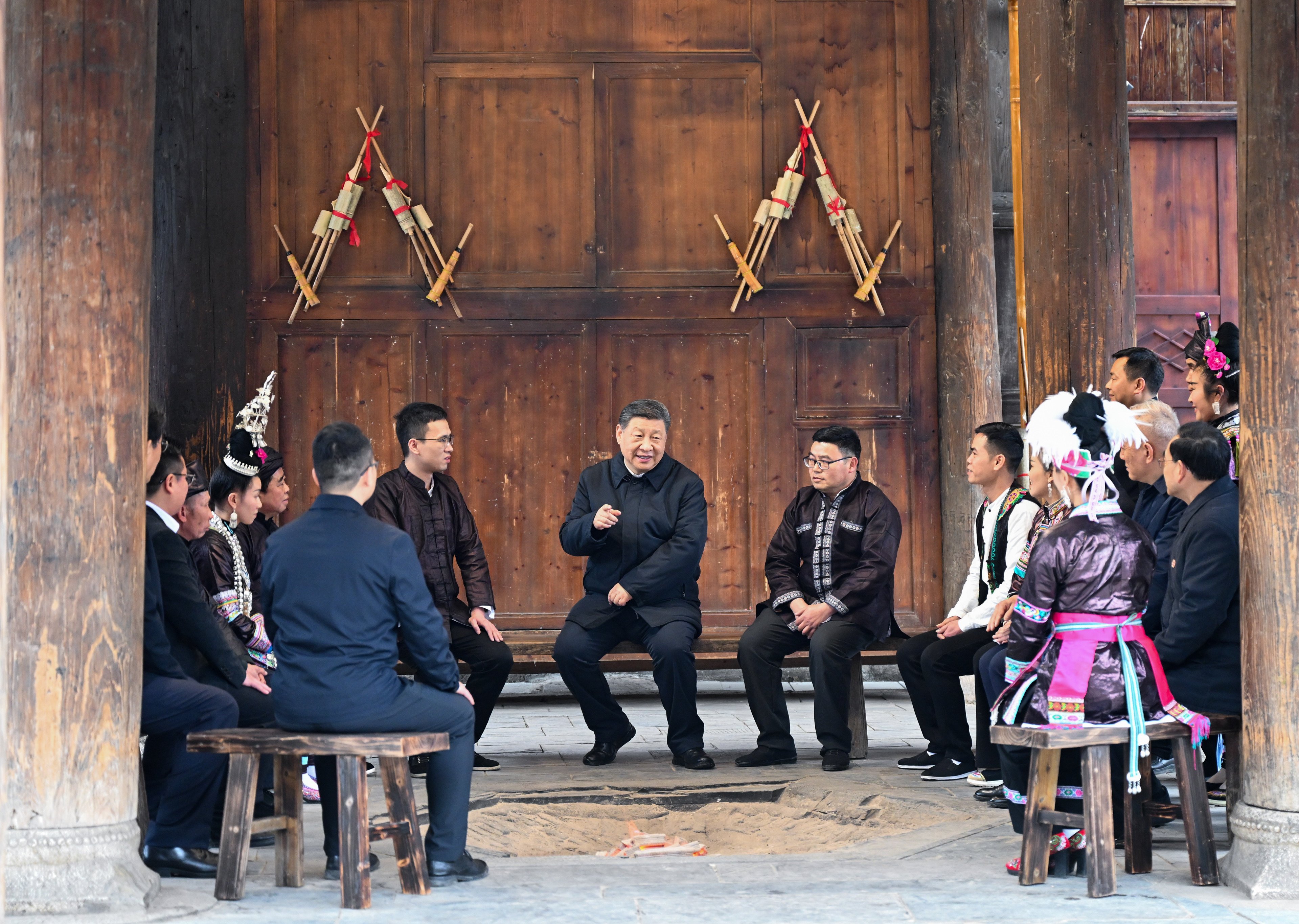 Chinese President Xi Jinping talks to villagers and party cadres during a visit to southwestern Guizhou province in March. Beijing’s first set of austerity measures was issued in November 2013, less than a year after Xi took office. Photo: Xinhua