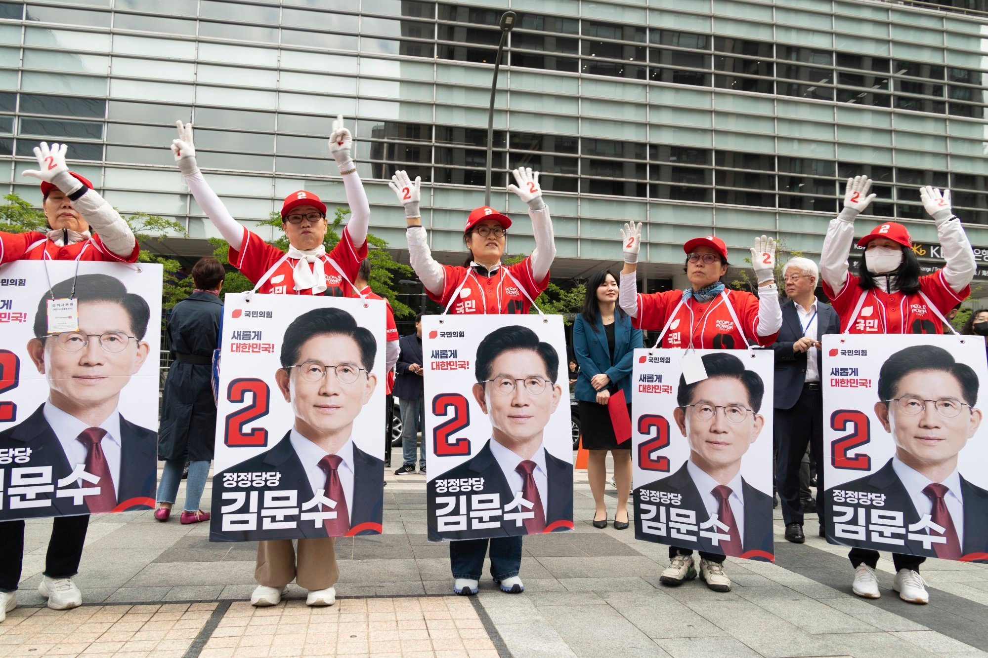 Supporters of Kim Moon-soo, presidential candidate of the People Power Party, cheer during an election campaign event in Seoul on Monday. Photo: EPA-EFE Supporters of Kim Moon-soo, presidential candidate of the People Power Party, cheer during an election campaign event in Seoul on Monday. Photo: EPA-EFE