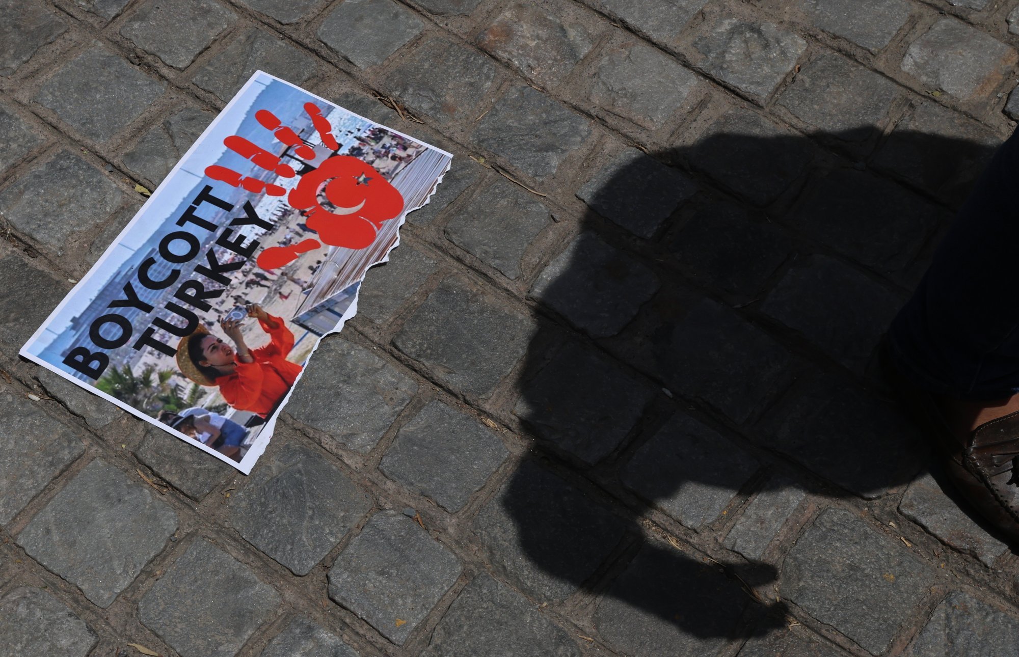 A torn placard is seen on the ground in New Delhi on Friday during a protest against Turkey. Photo: EPA-EFE A torn placard is seen on the ground in New Delhi on Friday during a protest against Turkey. Photo: EPA-EFE