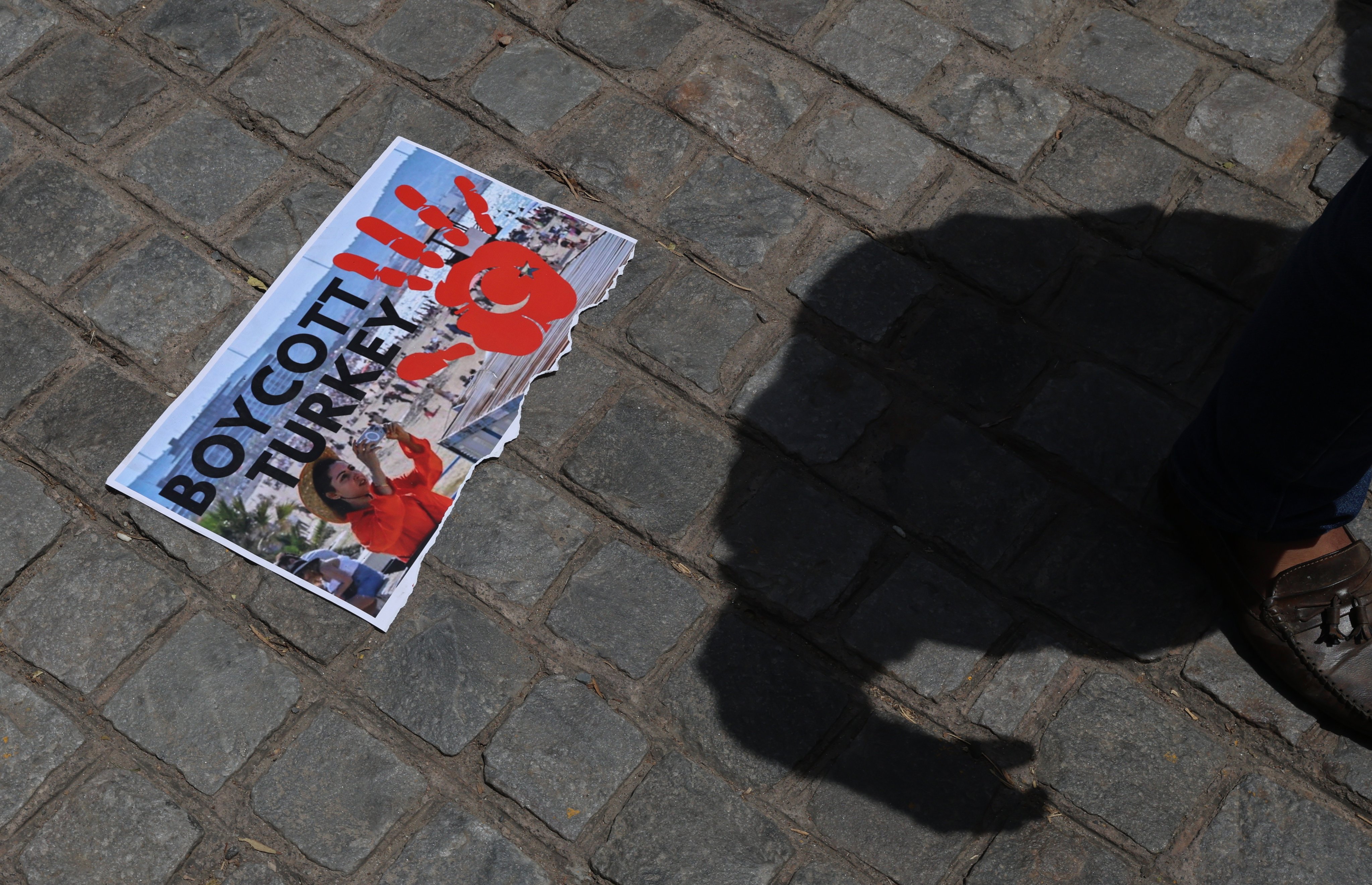 A torn placard is seen on the ground in New Delhi on Friday during a protest against Turkey. Photo: EPA-EFE