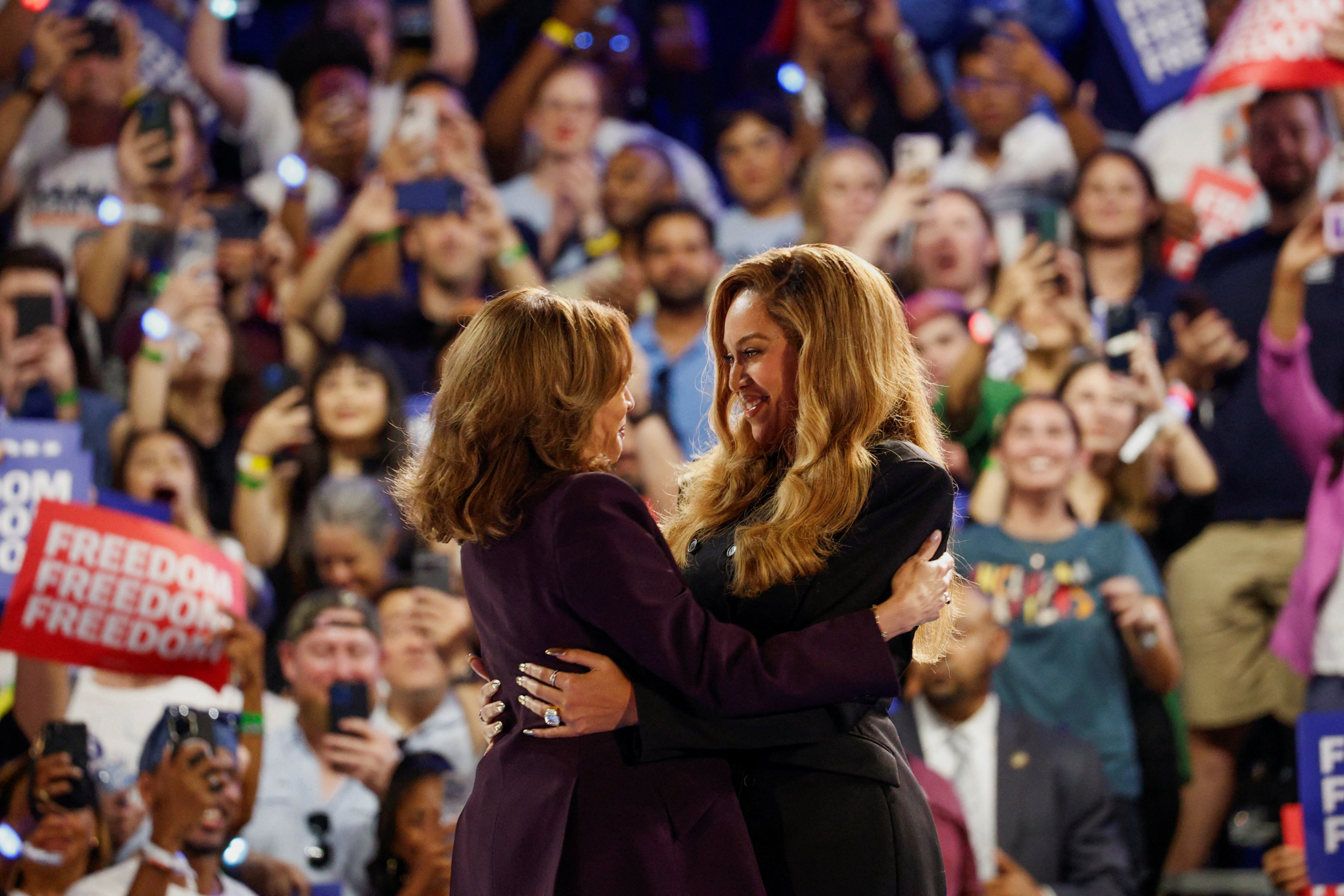 Singer Beyonce, right, and Kamala Harris embrace at a campaign rally for Harris in Houston, Texas on October 25. Photo: Reuters