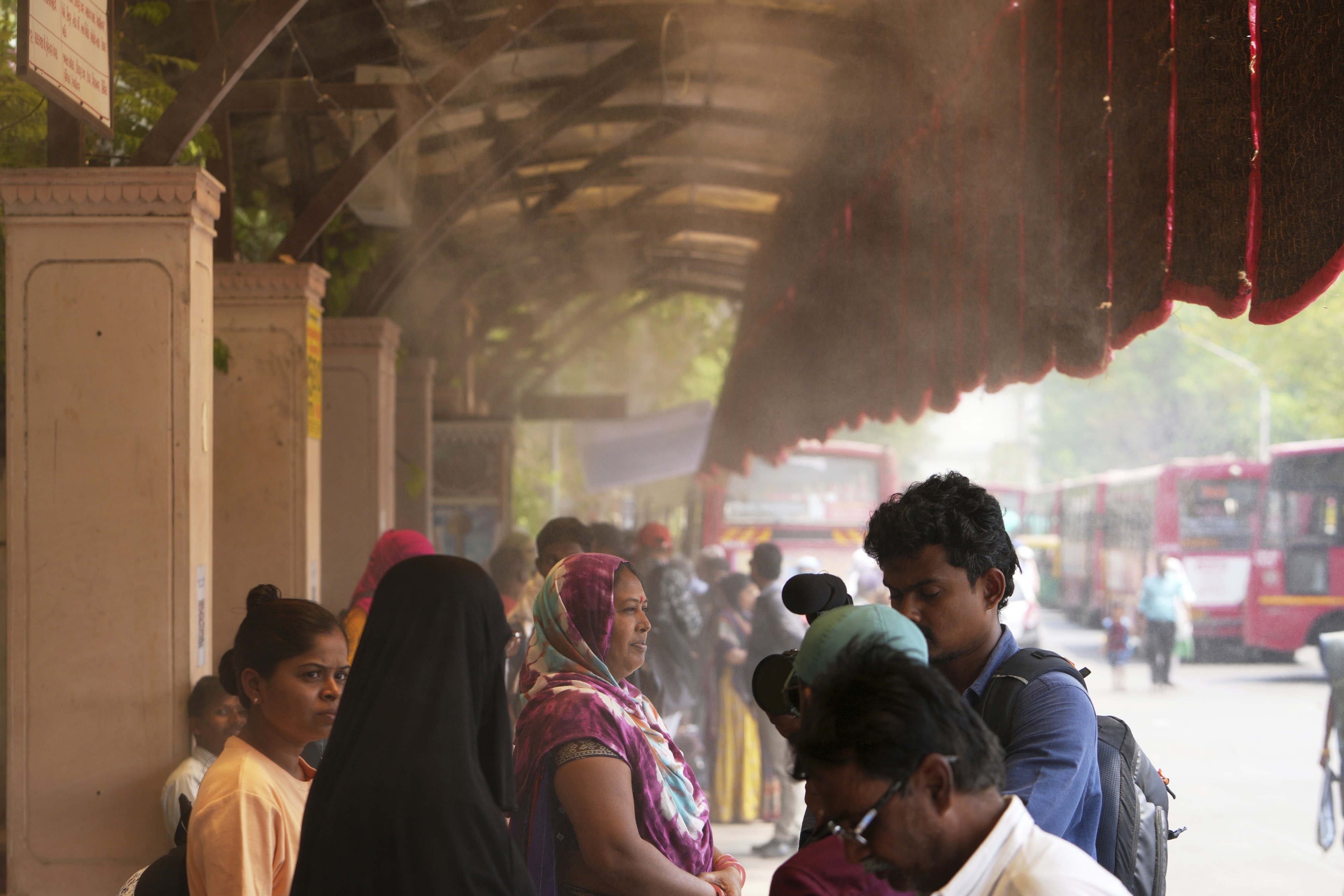 Ahmedabad combats rising temperatures with reflective paint on roofs and innovative sprinkler bus stops. Photo: AP