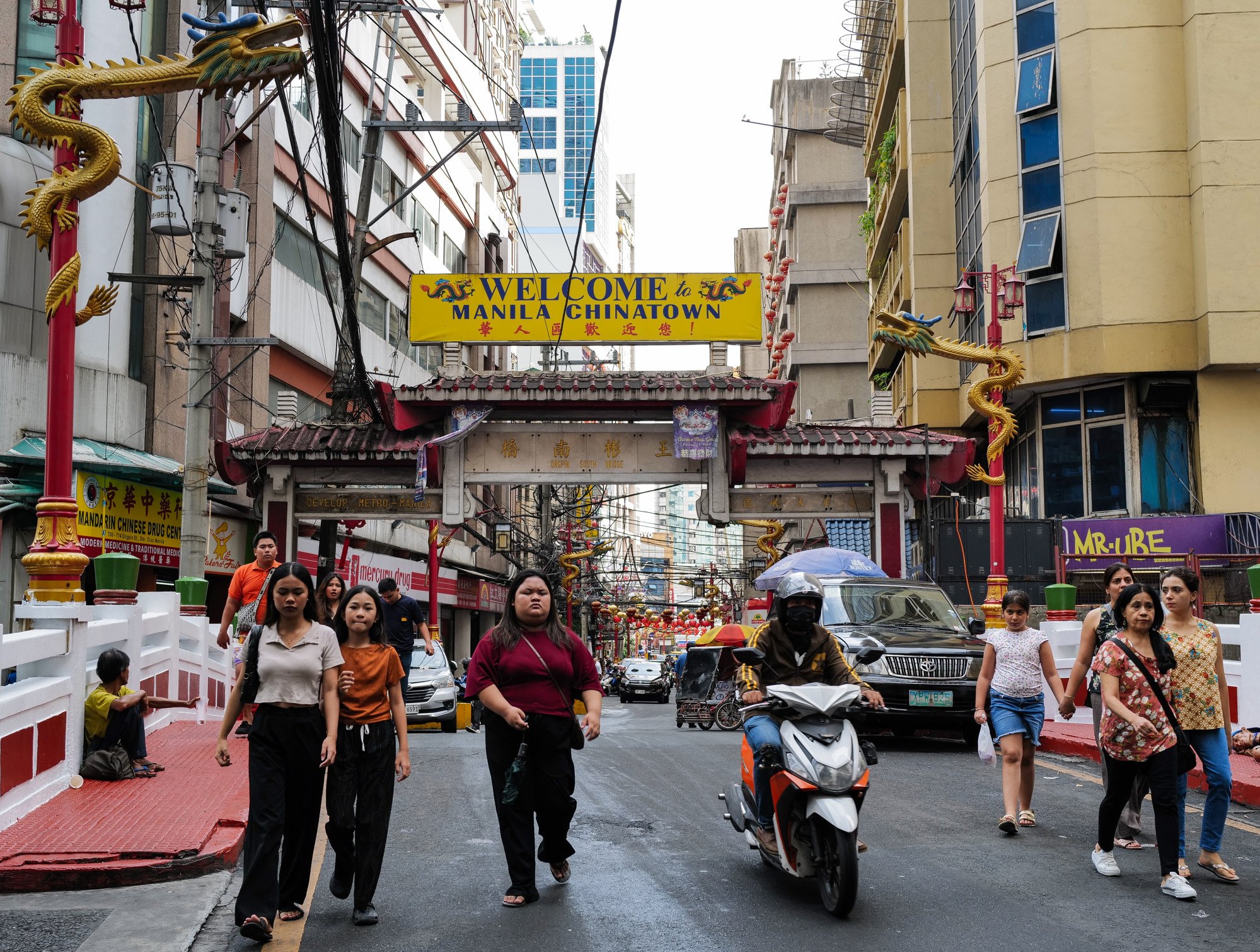 Locals walk in Manila’s Chinatown in Binondo on April 28. Photo: Jeoffrey Maitem Locals walk in Manila’s Chinatown in Binondo on April 28. Photo: Jeoffrey Maitem