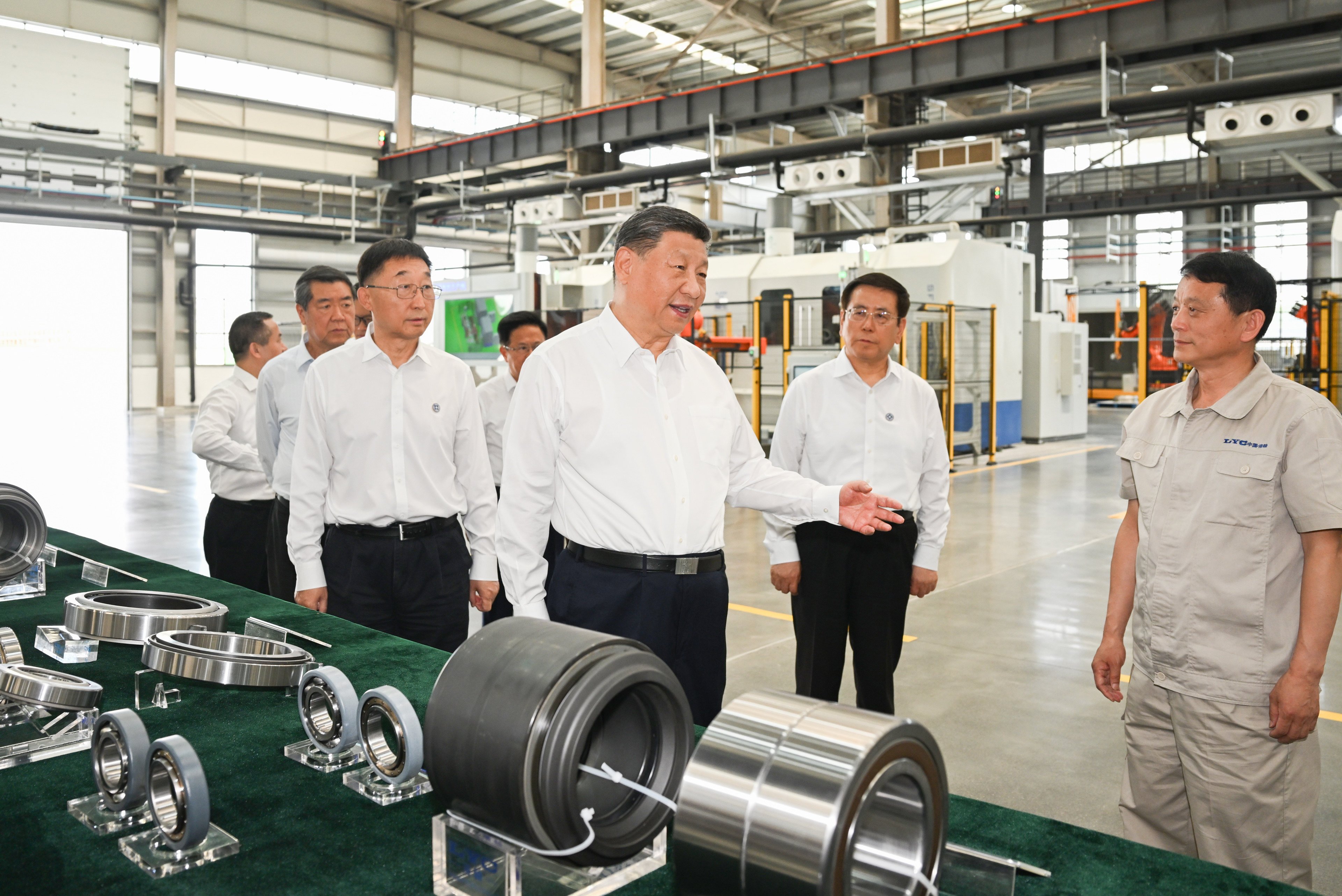 President Xi Jinping learns about local efforts to accelerate the development of advanced manufacturing while visiting the Luoyang Bearing Group in Luoyang, Henan province, on Monday. Photo: Xinhua