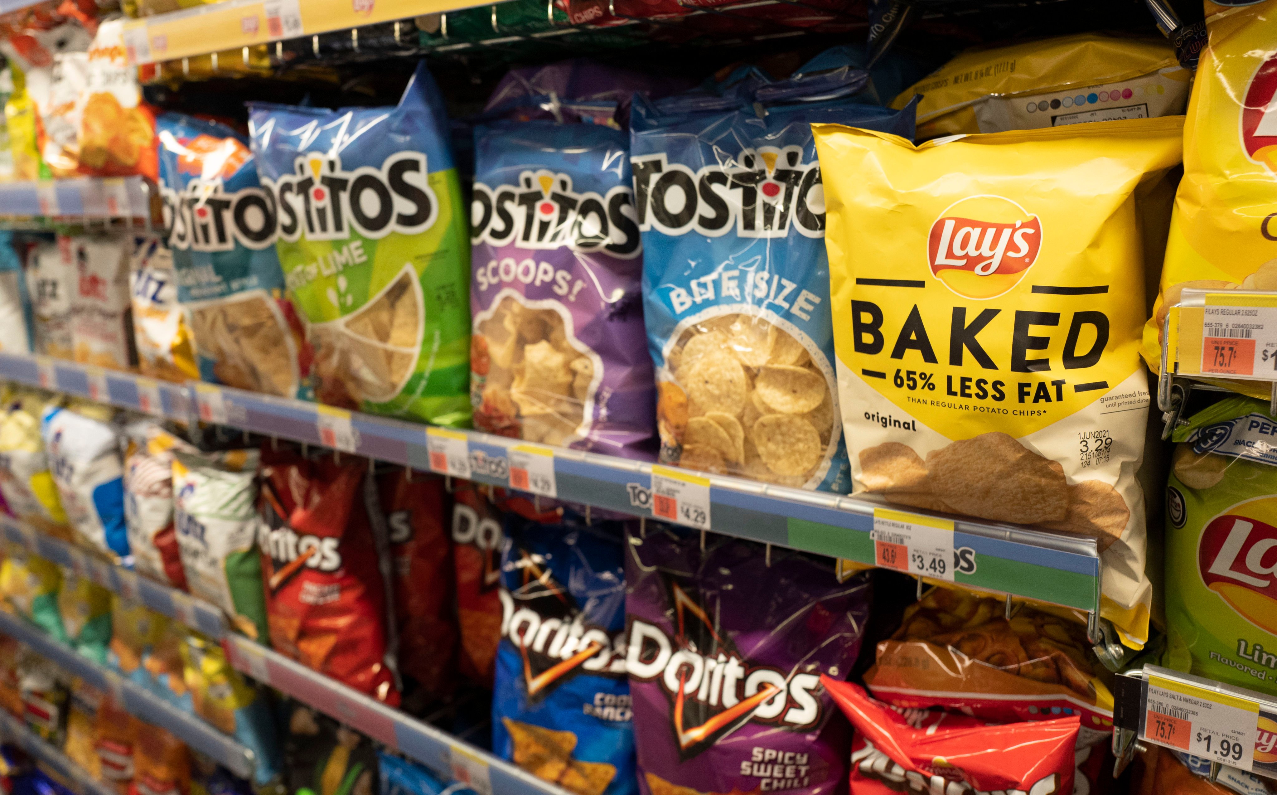 Potato and tortilla chips, an ultra-processed food, are displayed in a pharmacy in New York. Photo: AP