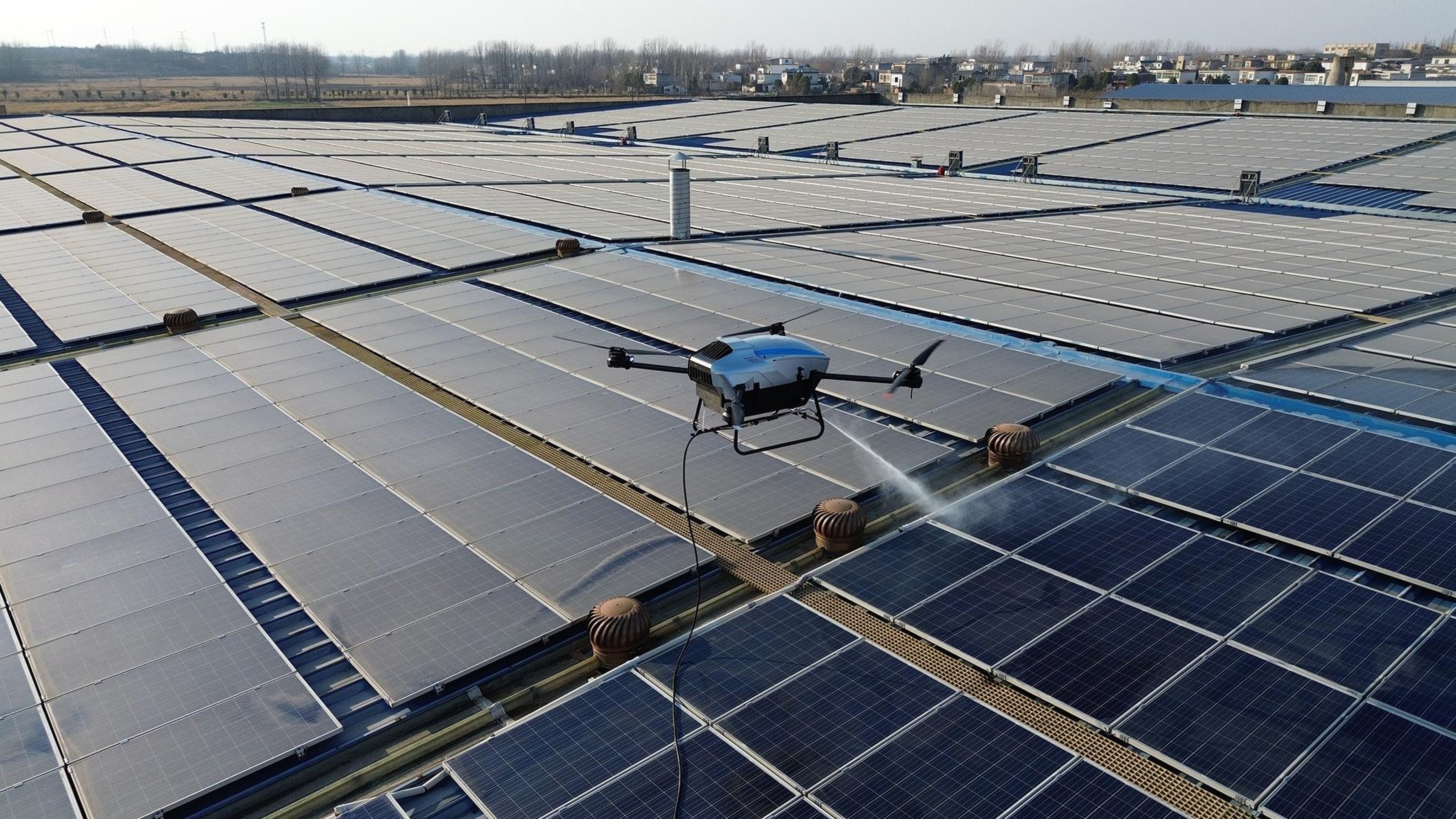 A HiTS drone powered by a hydrogen fuel cell cleans dust off roof-top solar panels. Photo: Handout