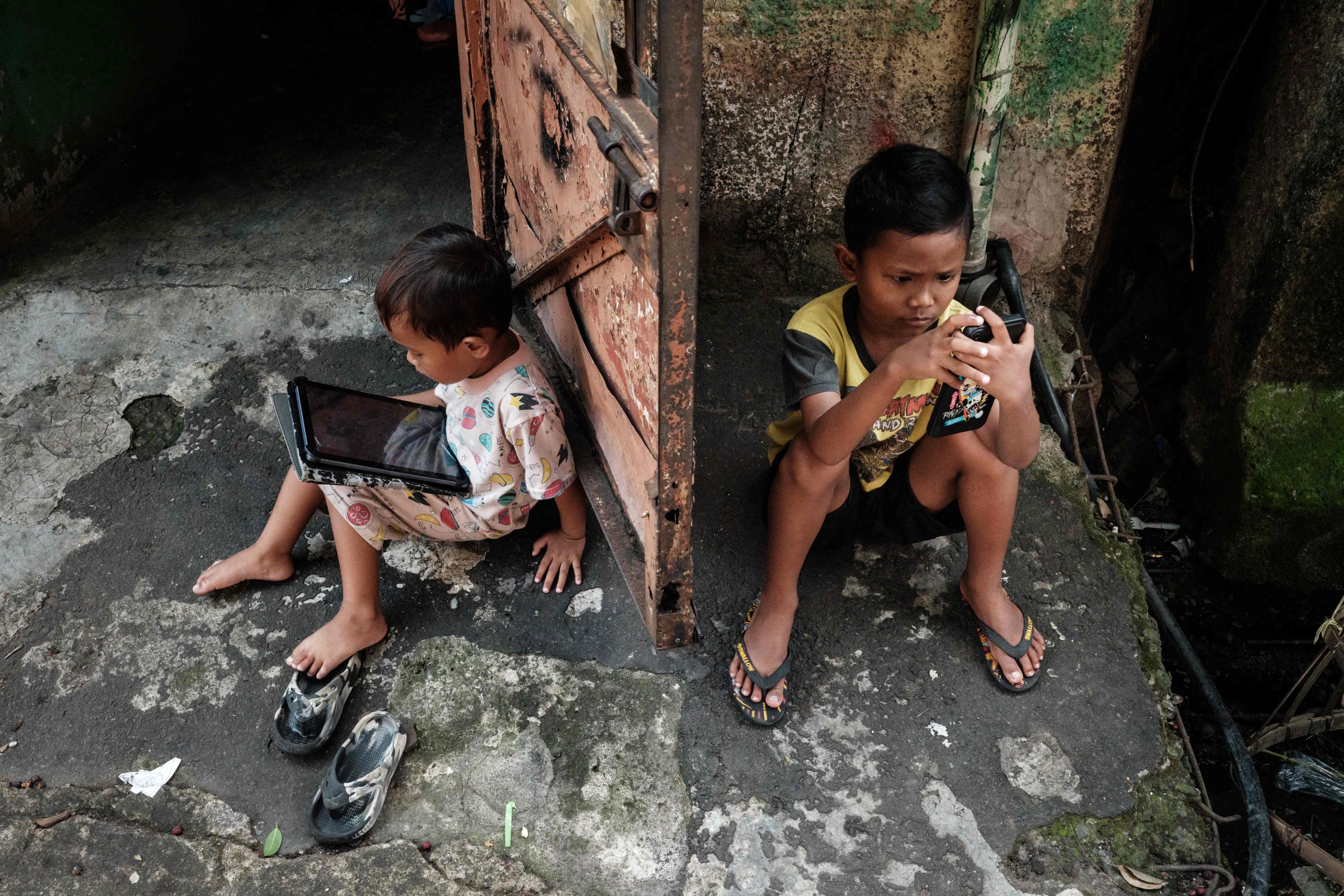 Children in Jakarta use digital devices to browse the internet earlier this month. Photo: AFP