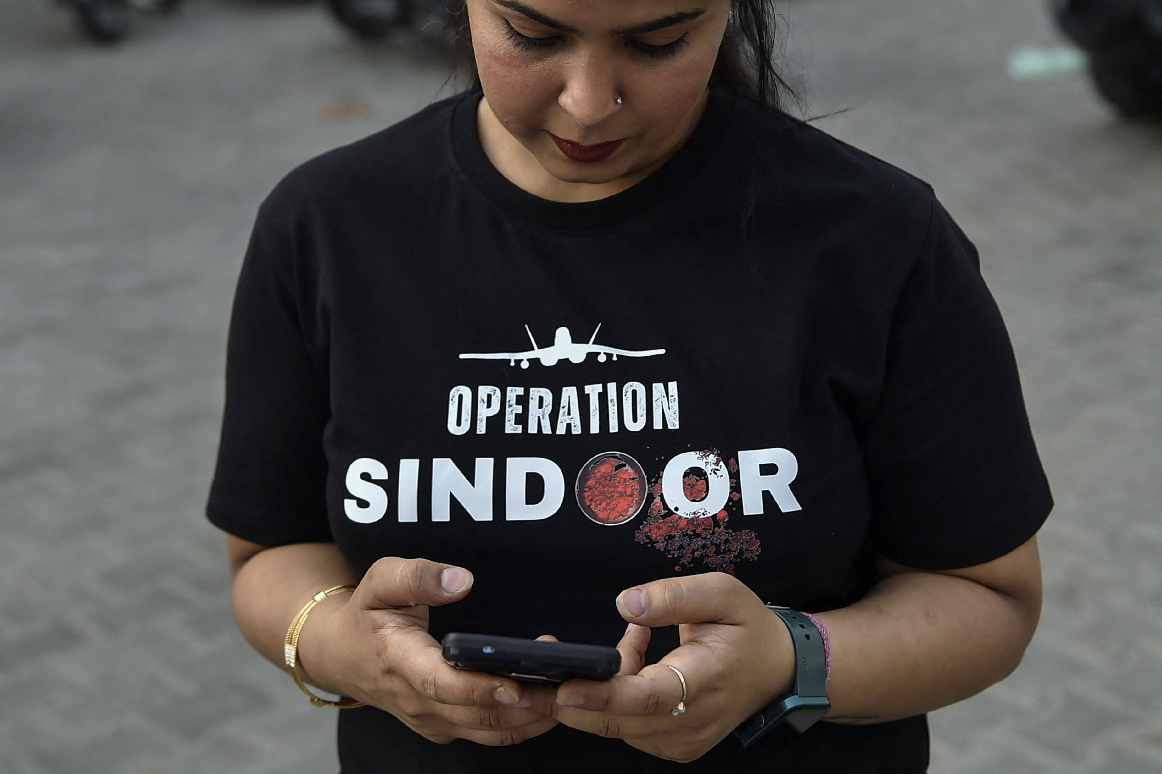 A woman wears in Ludhiana, India, wears a T-shirt emblazoned “Operation Sindoor”, the name of the military operation against Pakistan in response to a militant attack in Indian Kashmir. Businesses have cashed in on a surge in nationalism. Photo: AFP