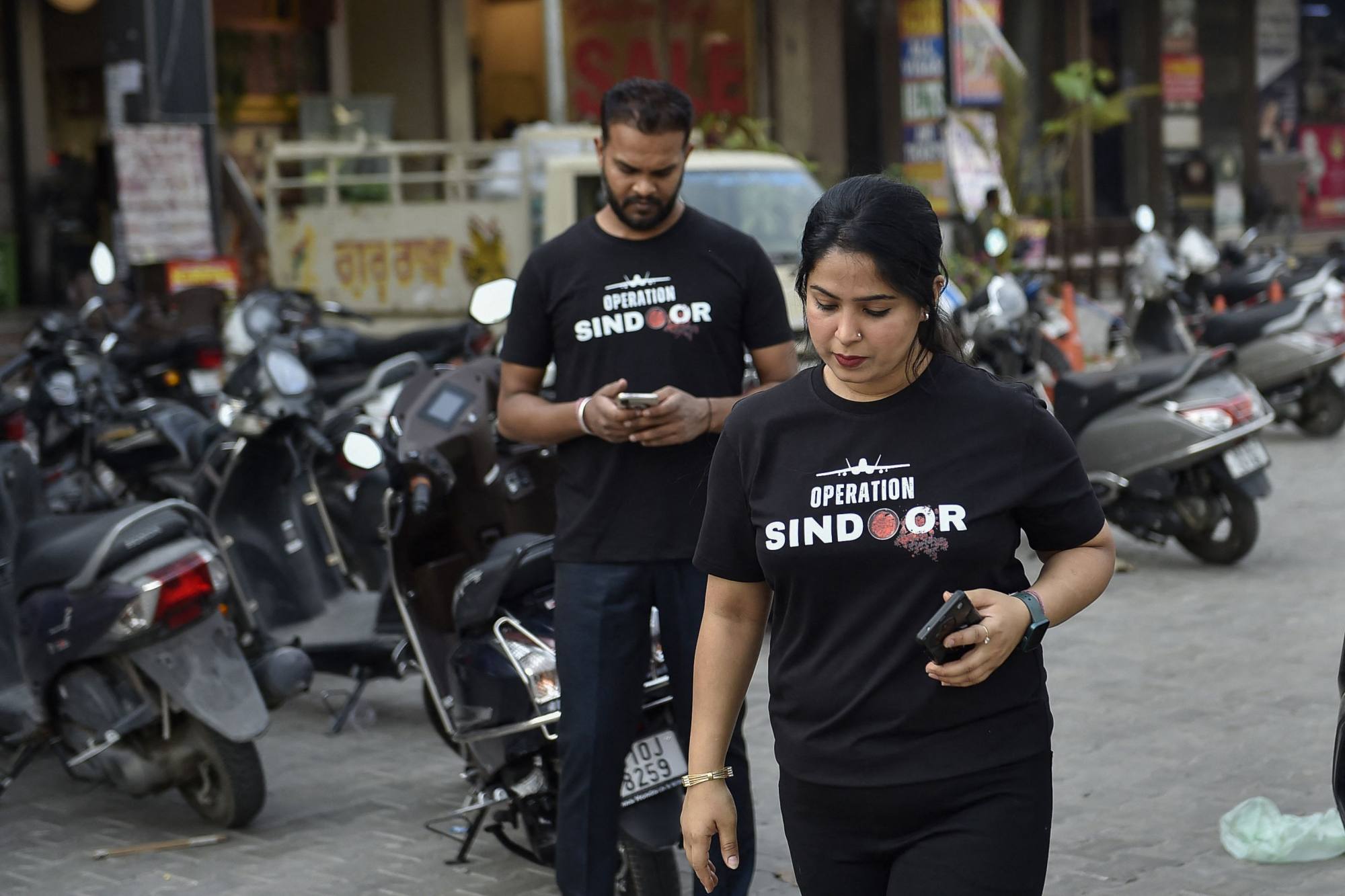 People wearing T-shirts emblazoned “Operation Sindoor” on a street in Ludhiana, India. Photo: AFP People wearing T-shirts emblazoned “Operation Sindoor” on a street in Ludhiana, India. Photo: AFP