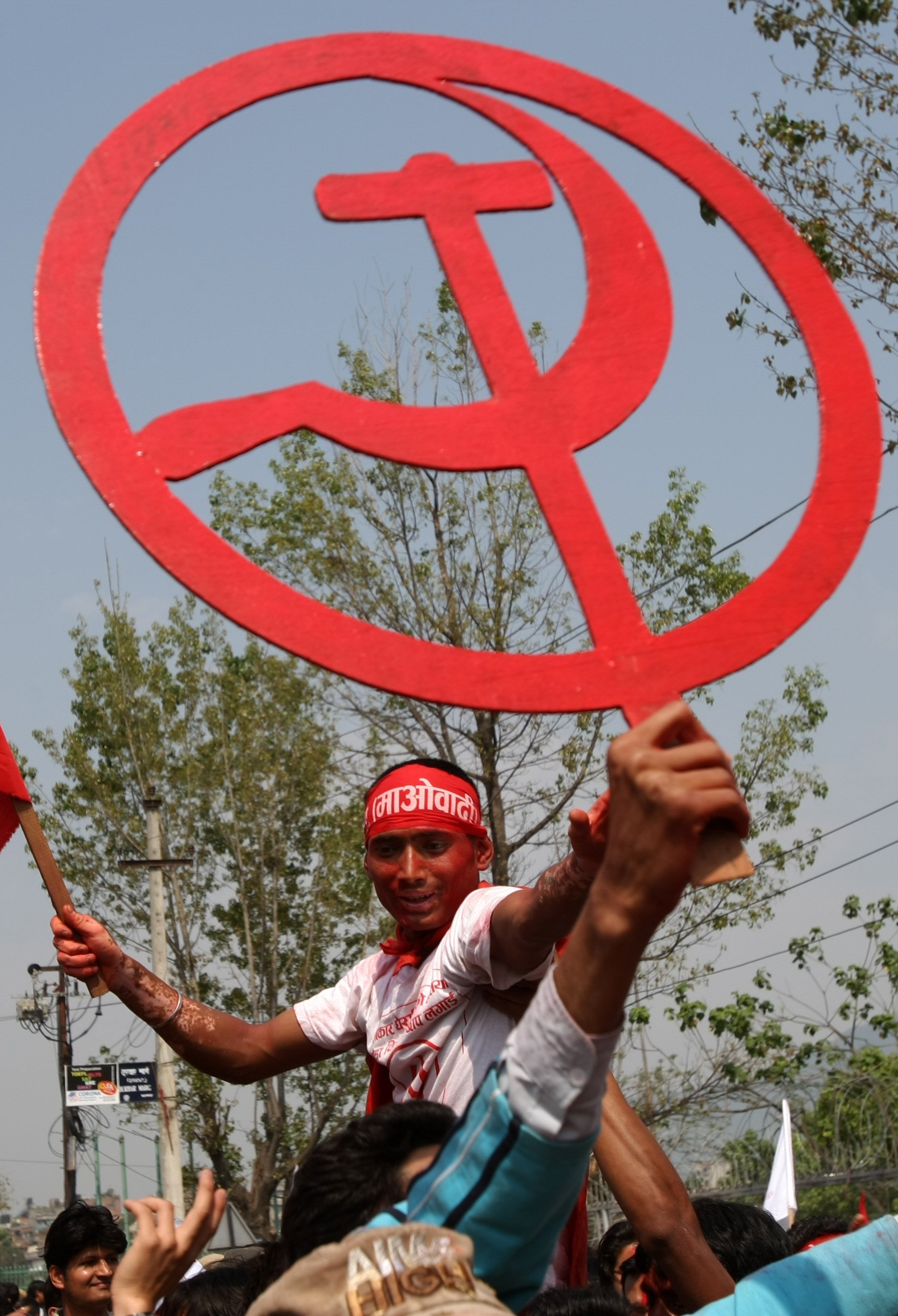 Supporters of the Communist Party of Nepal Maoist hold the communist “Hammer and Sickle”. The Maoist-inspired guerilla movement began nearly 60 years ago. Photo: AFP Supporters of the Communist Party of Nepal Maoist hold the communist “Hammer and Sickle”. The Maoist-inspired guerilla movement began nearly 60 years ago. Photo: AFP