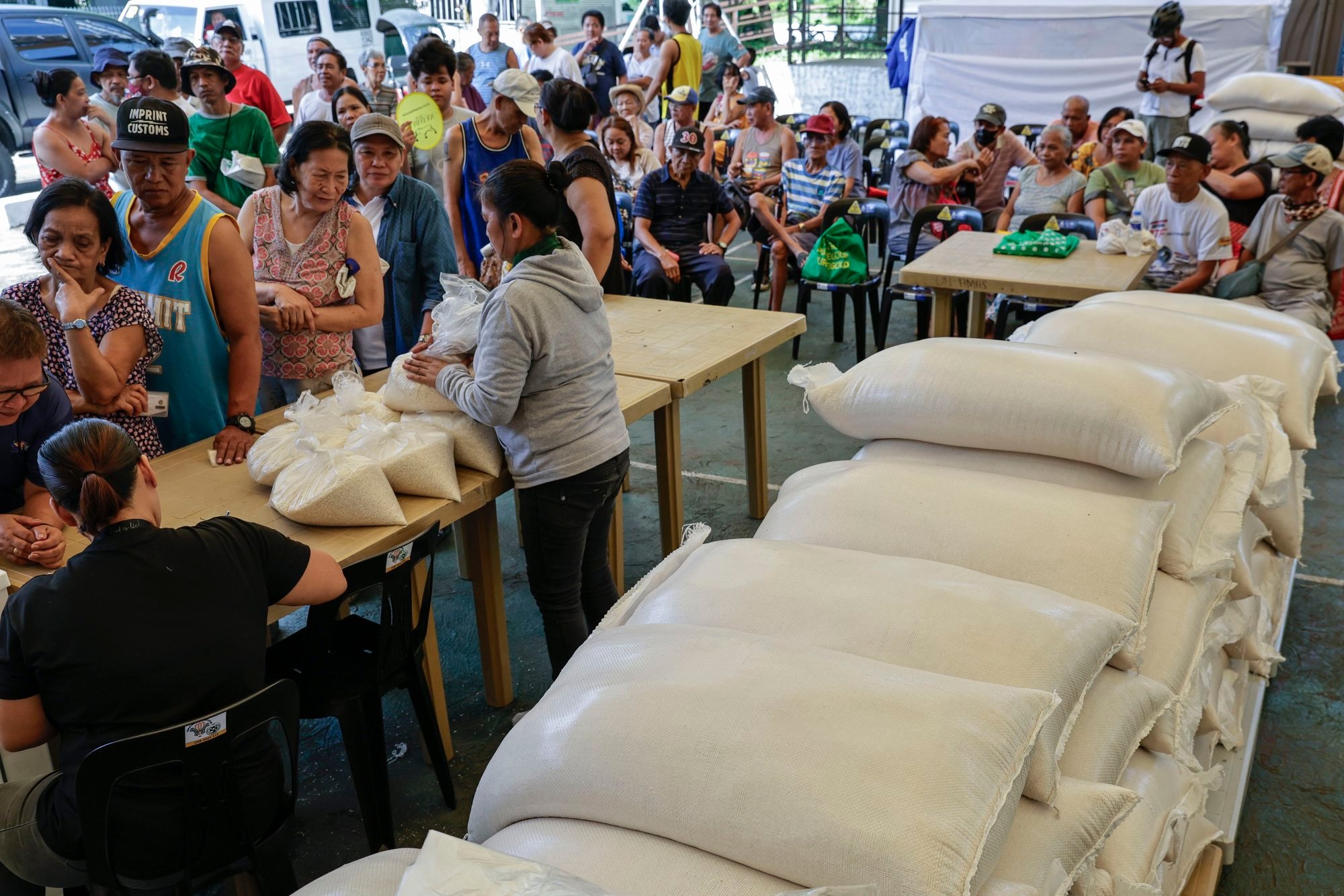 Filipinos queue to purchase rice at a government mini-market in Quezon City, Metro Manila, in the Philippines on May 15. Food security ranked among the top concerns for voters in the May 12 midterm election. Photo: EPA-EFE Filipinos queue to purchase rice at a government mini-market in Quezon City, Metro Manila, in the Philippines on May 15. Food security ranked among the top concerns for voters in the May 12 midterm election. Photo: EPA-EFE