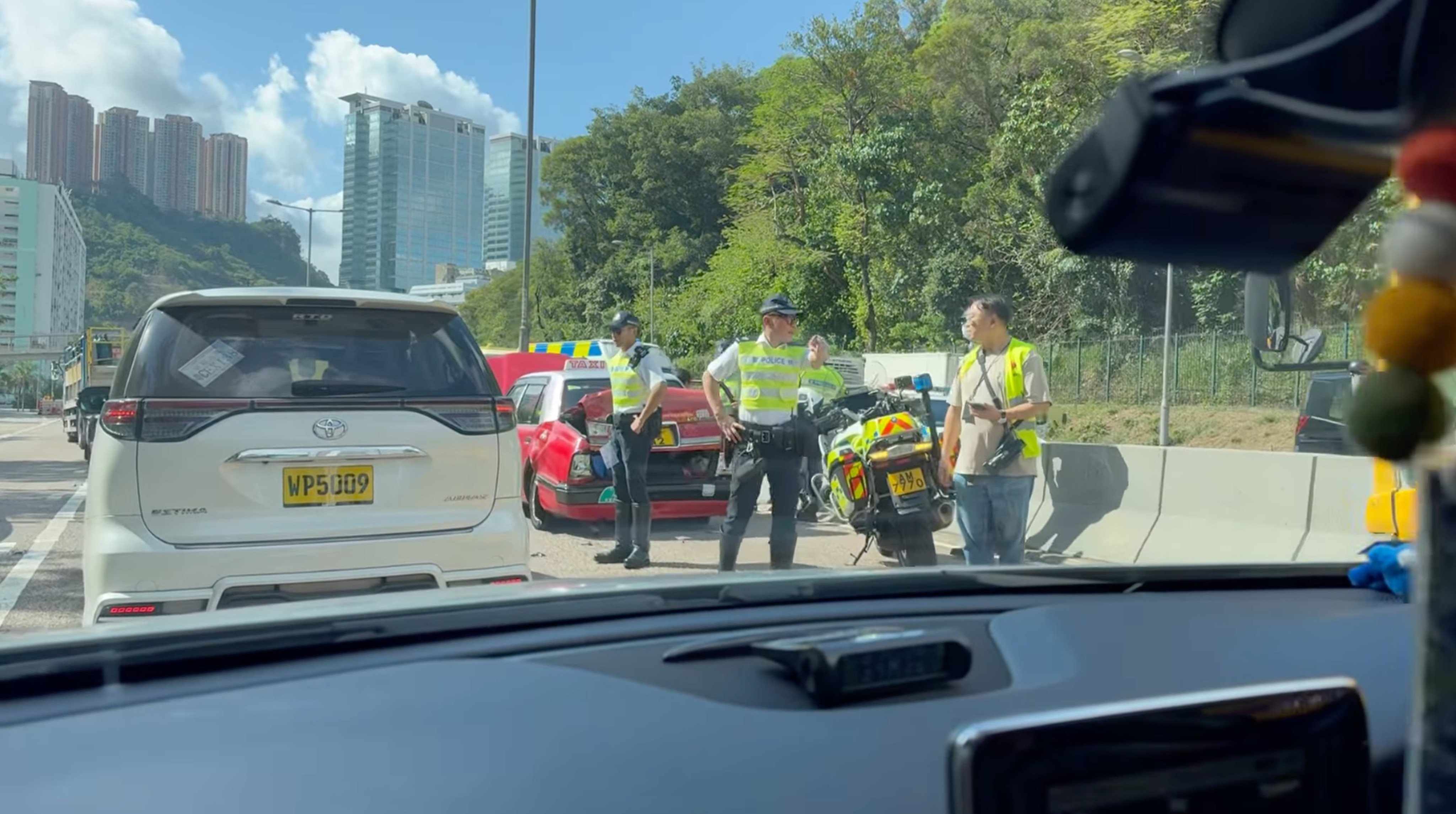 A collision near Kwai Chung involving a taxi, a school bus and a minibus has left nine people injured. Photo: Facebook