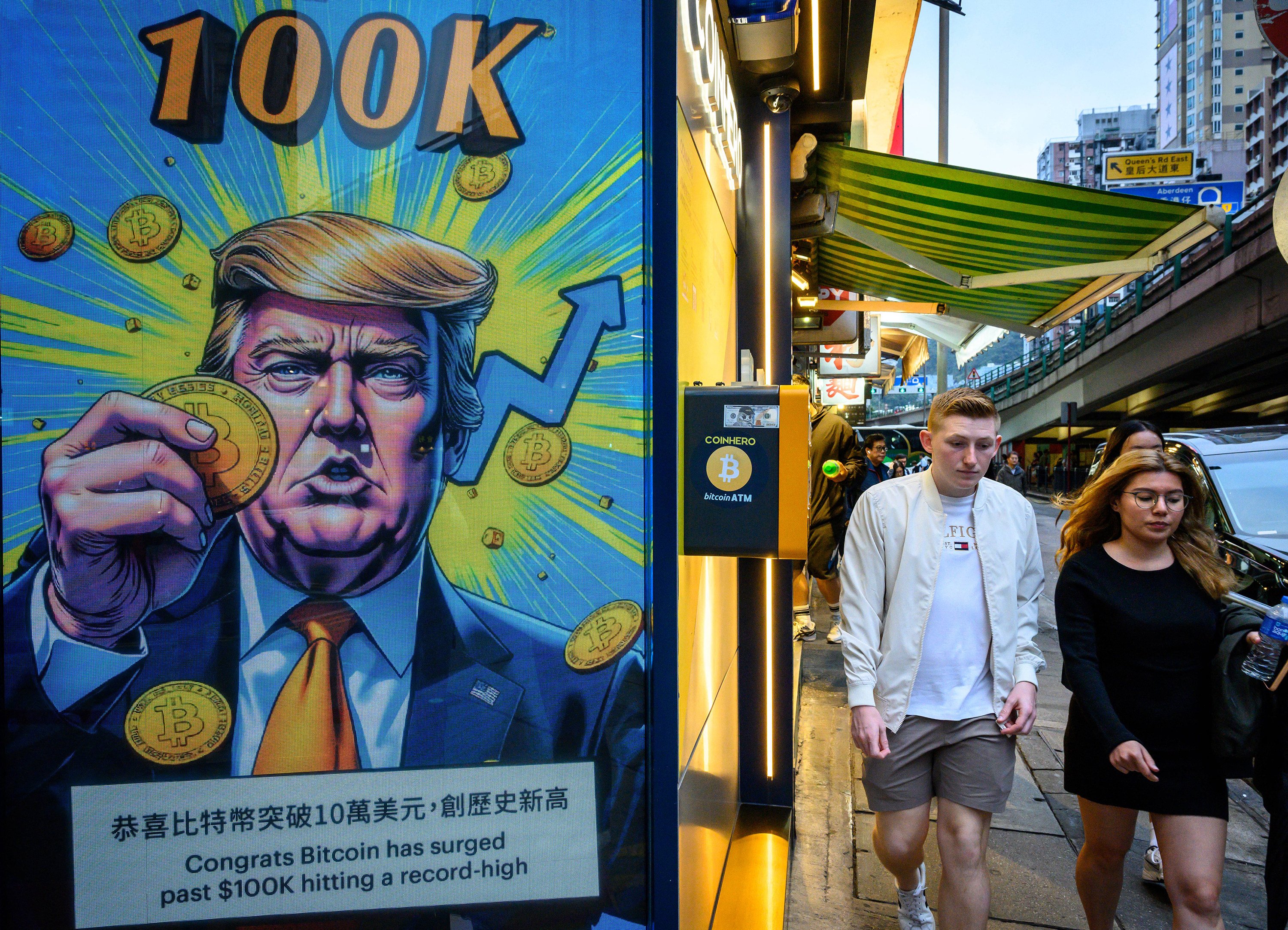 A cryptocurrency exchange office in Hong Kong with a screen featuring US President Donald Trump. Photo: AFP/Getty Images/TNS