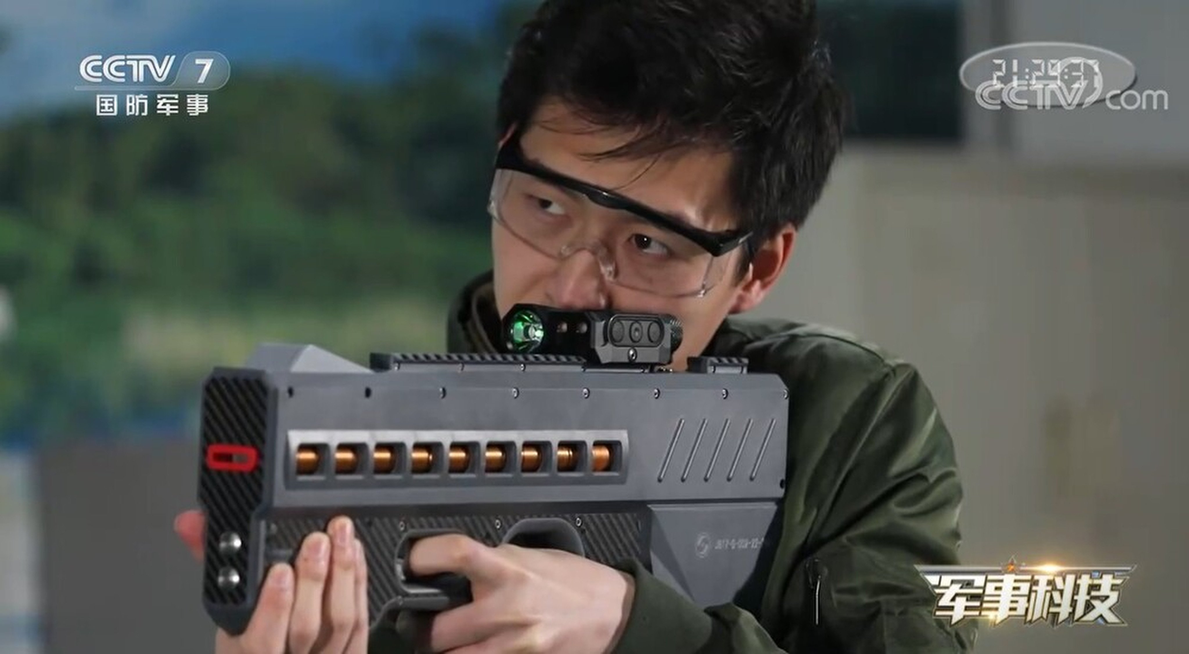China has unveiled a powerful new electromagnetic gun believed to be powered by lithium batteries. This version (pictured) is a non-lethal weapon that fires coin-shaped bullets with electromagnetic force and would be used for riot control.  Photo: CCTV