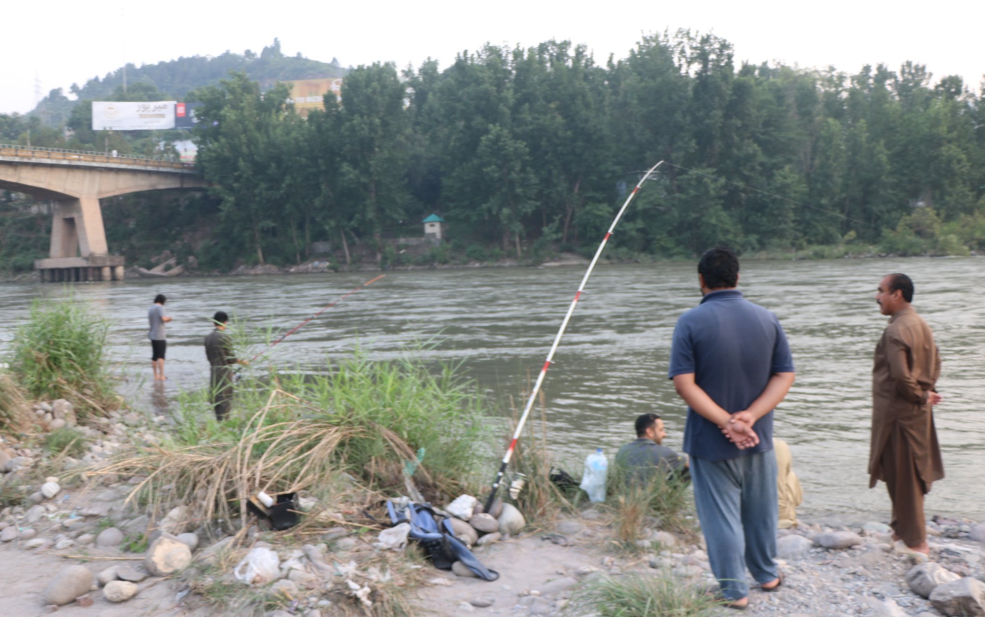 People sit on the bank of Neelum River as life returns to normal following the Pakistan-India ceasefire in Neelum Valley, Pakistani-administered Kashmir on Wednesday. Photo: EPA-EFE People sit on the bank of Neelum River as life returns to normal following the Pakistan-India ceasefire in Neelum Valley, Pakistani-administered Kashmir on Wednesday. Photo: EPA-EFE