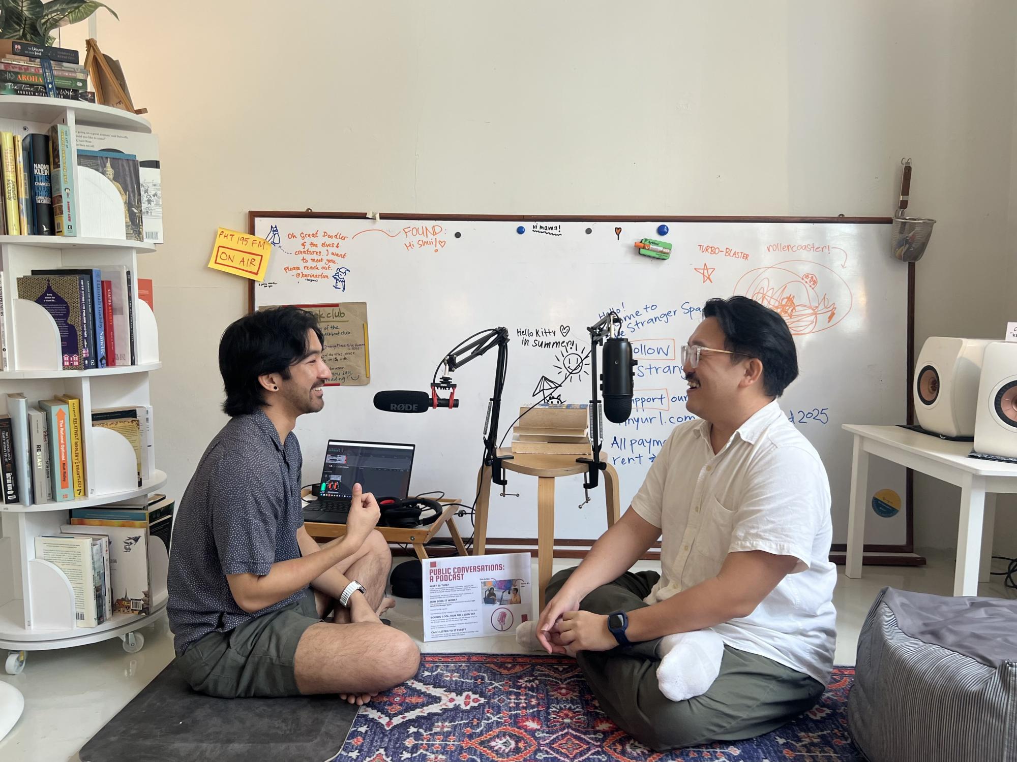 Benjamin Yap (left) recording a podcast episode with Tan Xing Jian, a fellow visitor at Stranger Conversations whom he had just met. Photo: Xinyi Wu Benjamin Yap (left) recording a podcast episode with Tan Xing Jian, a fellow visitor at Stranger Conversations whom he had just met. Photo: Xinyi Wu