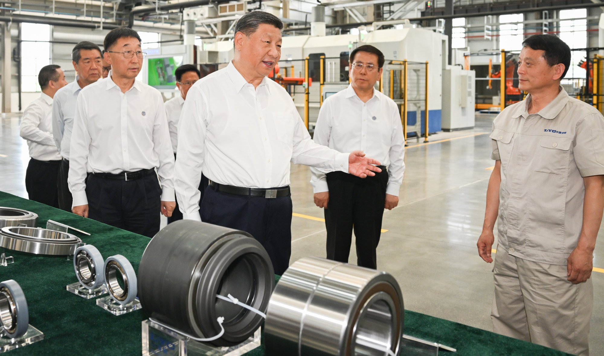 Chinese President Xi Jinping (centre) learns about local efforts to accelerate the development of advanced manufacturing while visiting the Luoyang Bearing Group on Monday. Photo: Xinhua Chinese President Xi Jinping (centre) learns about local efforts to accelerate the development of advanced manufacturing while visiting the Luoyang Bearing Group on Monday. Photo: Xinhua