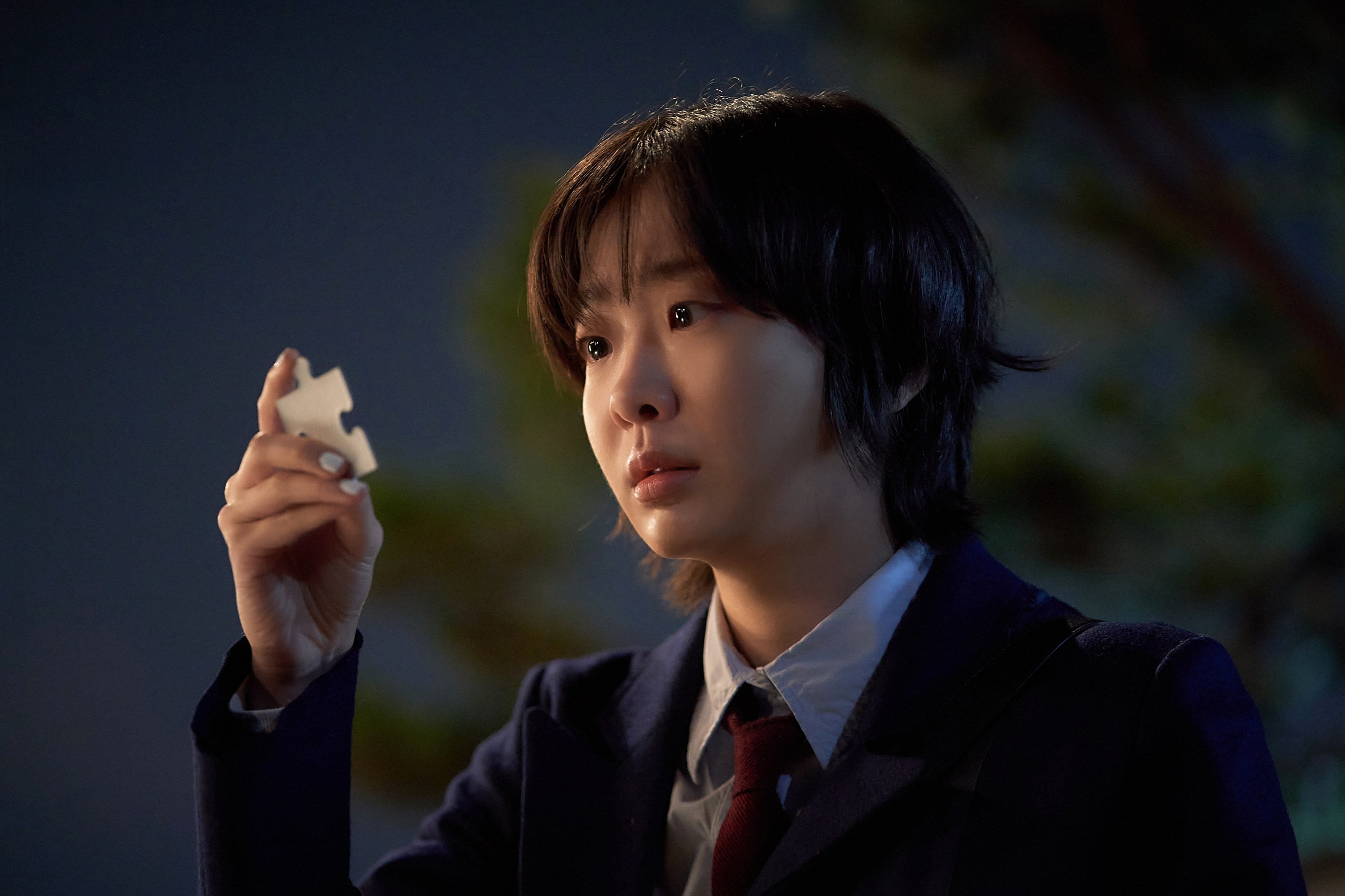 Kim Da-mi in a still from Nine Puzzles. Photo: Disney+
