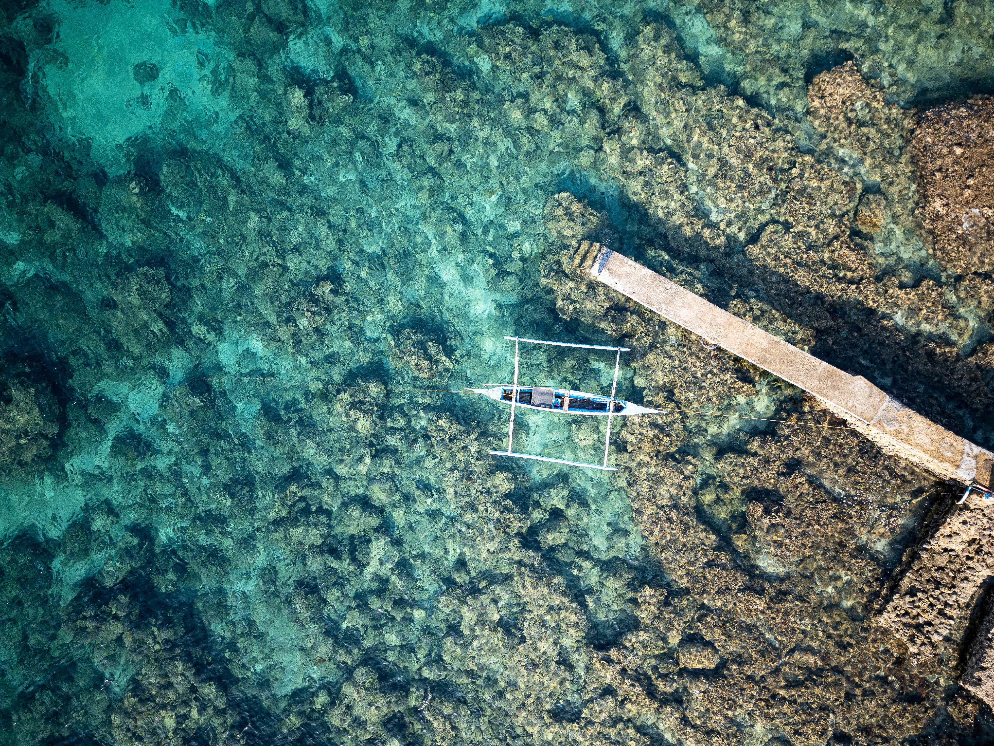 An aerial view of a fishing boat docked at a port in Bauan, Batangas province, Philippines, on March 10. Efforts to strengthen the coastguard could help lift coastal families out of poverty and enable small fishing towns to grow into vibrant regional trade centres. Photo: Reuters