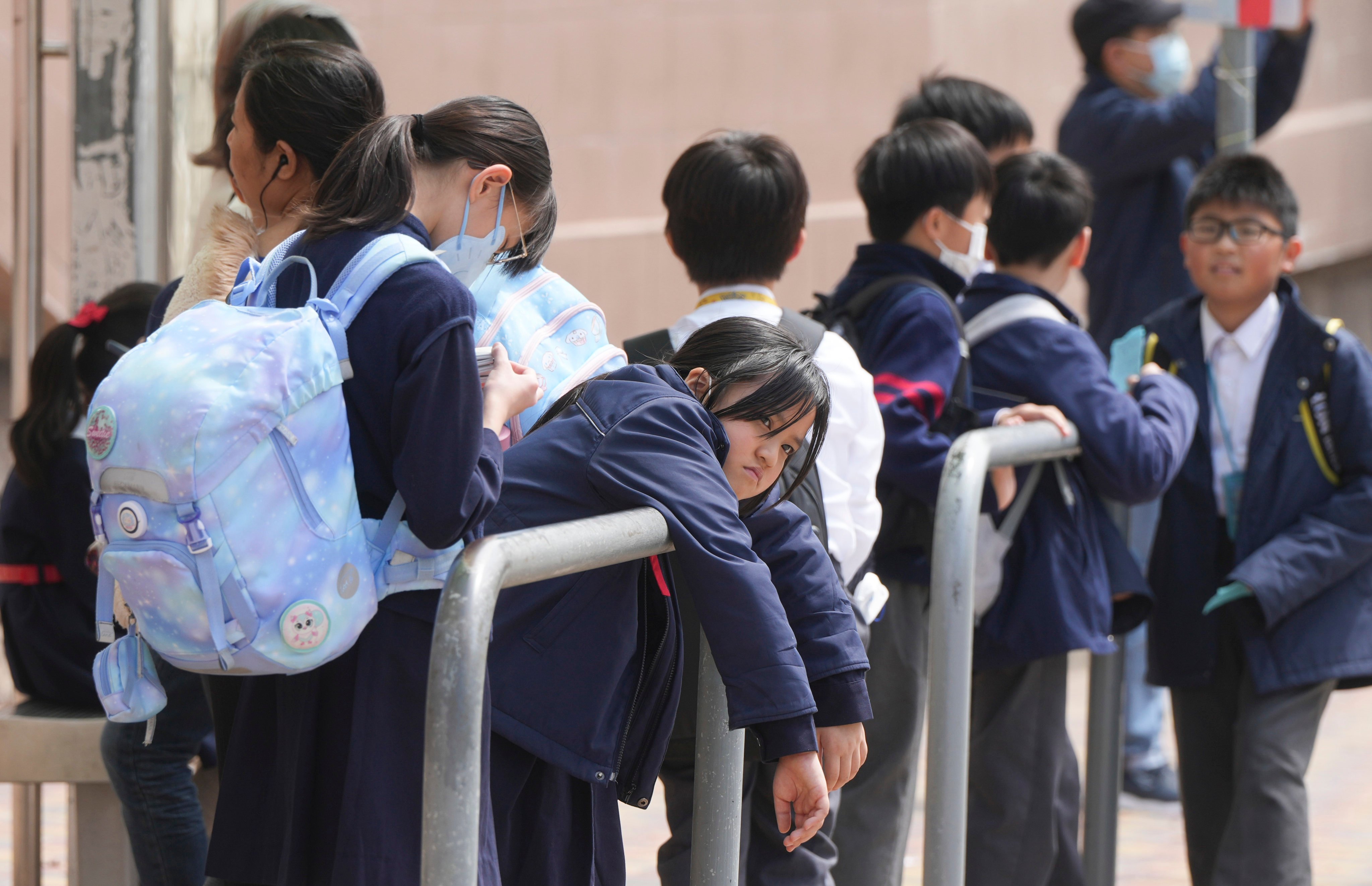 Children wait at the end of a school day at Tsz Wan Shan on February 27. Photo: Sam Tsang