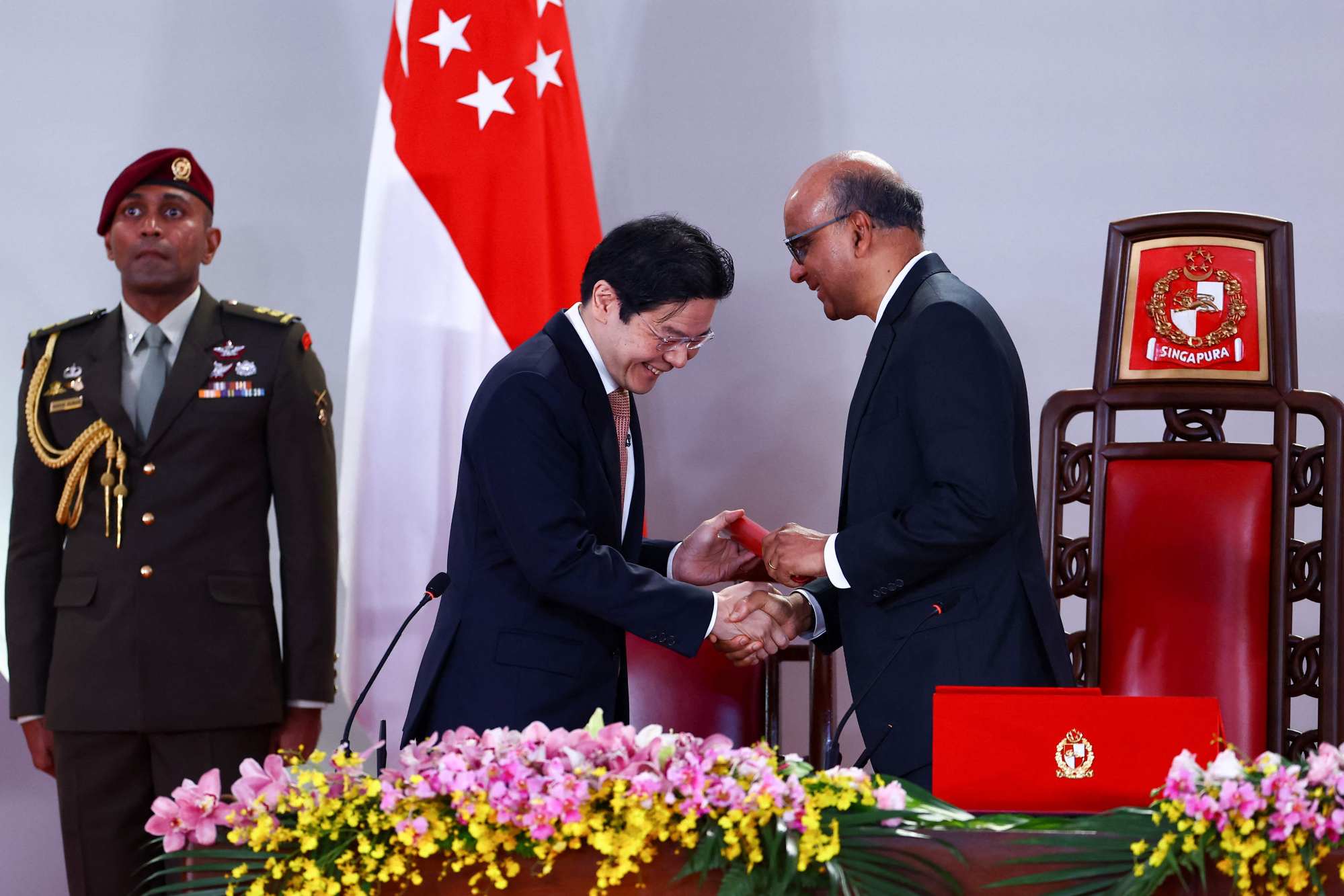 Singapore’s Prime Minister Lawrence Wong and President Tharman Shanmugaratnam at the cabinet swearing-in at the Istana on Friday. Photo: AFP Singapore’s Prime Minister Lawrence Wong and President Tharman Shanmugaratnam at the cabinet swearing-in at the Istana on Friday. Photo: AFP