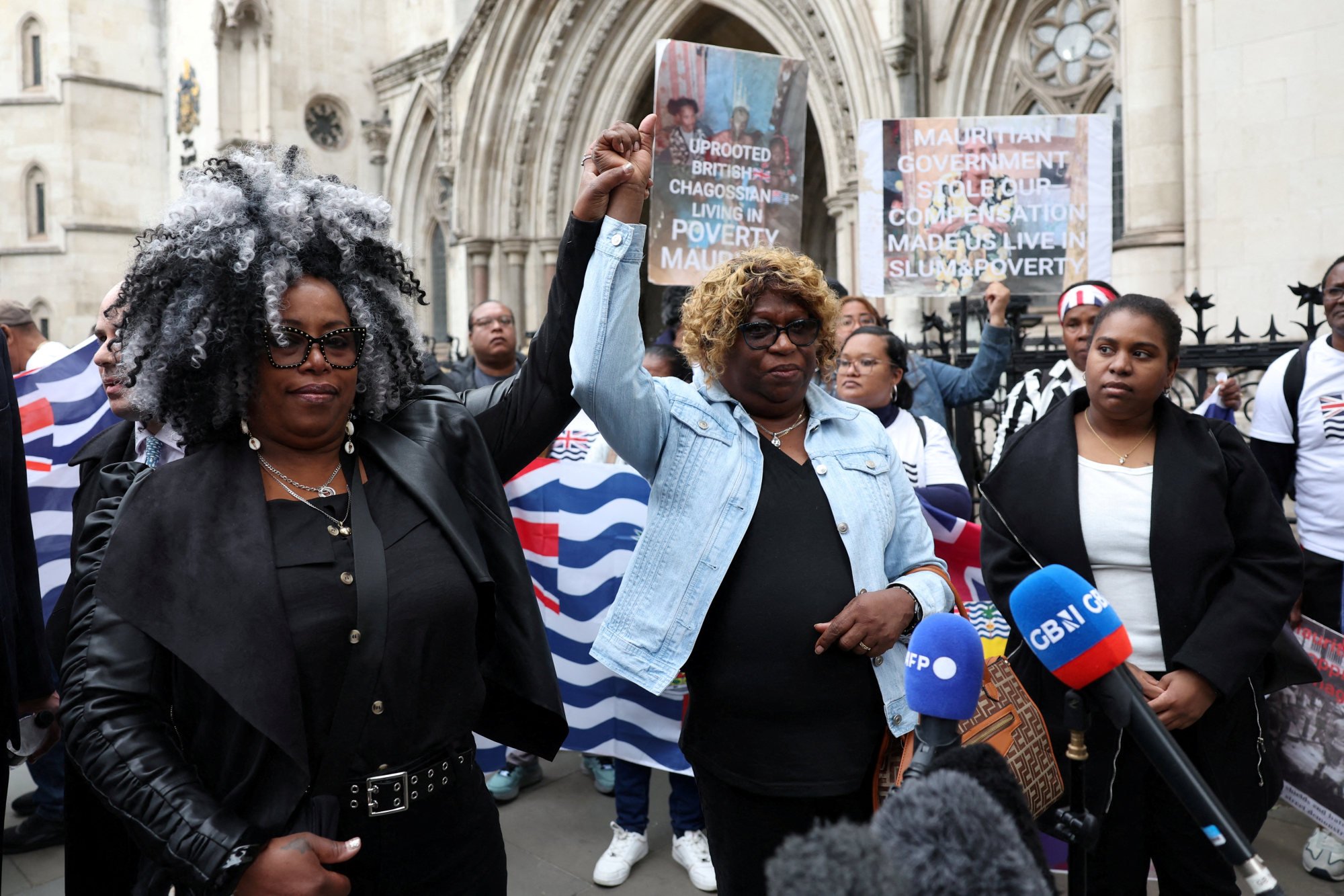Bertrice Pompe and Bernadette Dugasse gesture after a judge at London’s High Court overturned an injunction that temporarily blocked the UK from concluding Chagos Islands deal with Mauritius, outside the court, in London, Britain, on May 22. Photo: Reuters Bertrice Pompe and Bernadette Dugasse gesture after a judge at London’s High Court overturned an injunction that temporarily blocked the UK from concluding Chagos Islands deal with Mauritius, outside the court, in London, Britain, on May 22. Photo: Reuters