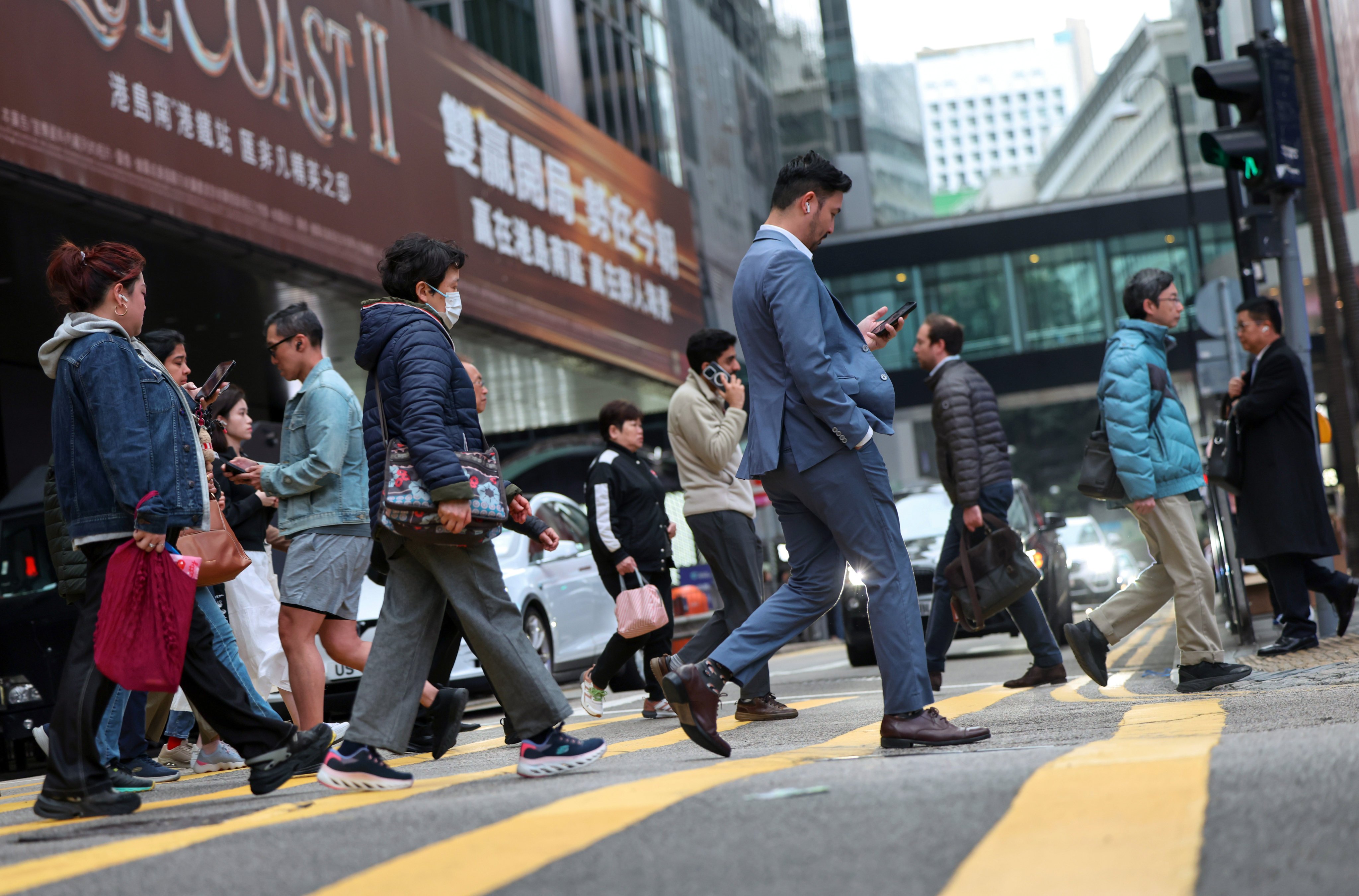 People walk in Hong Kong’s Central district on March 18, 2025. Photo: Nora Tam