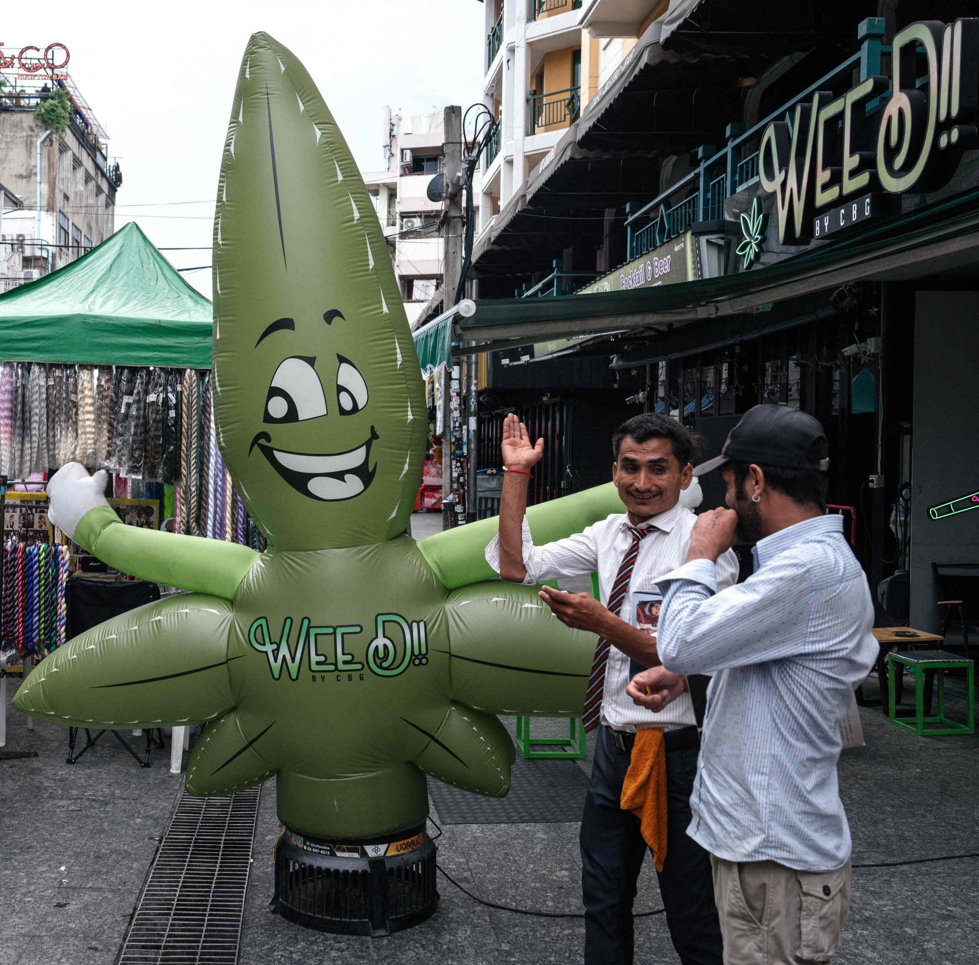 A marijuana leaf-shaped balloon in front of a cannabis dispensary on Khao San Road in Bangkok on Friday. Photo: AFP A marijuana leaf-shaped balloon in front of a cannabis dispensary on Khao San Road in Bangkok on Friday. Photo: AFP