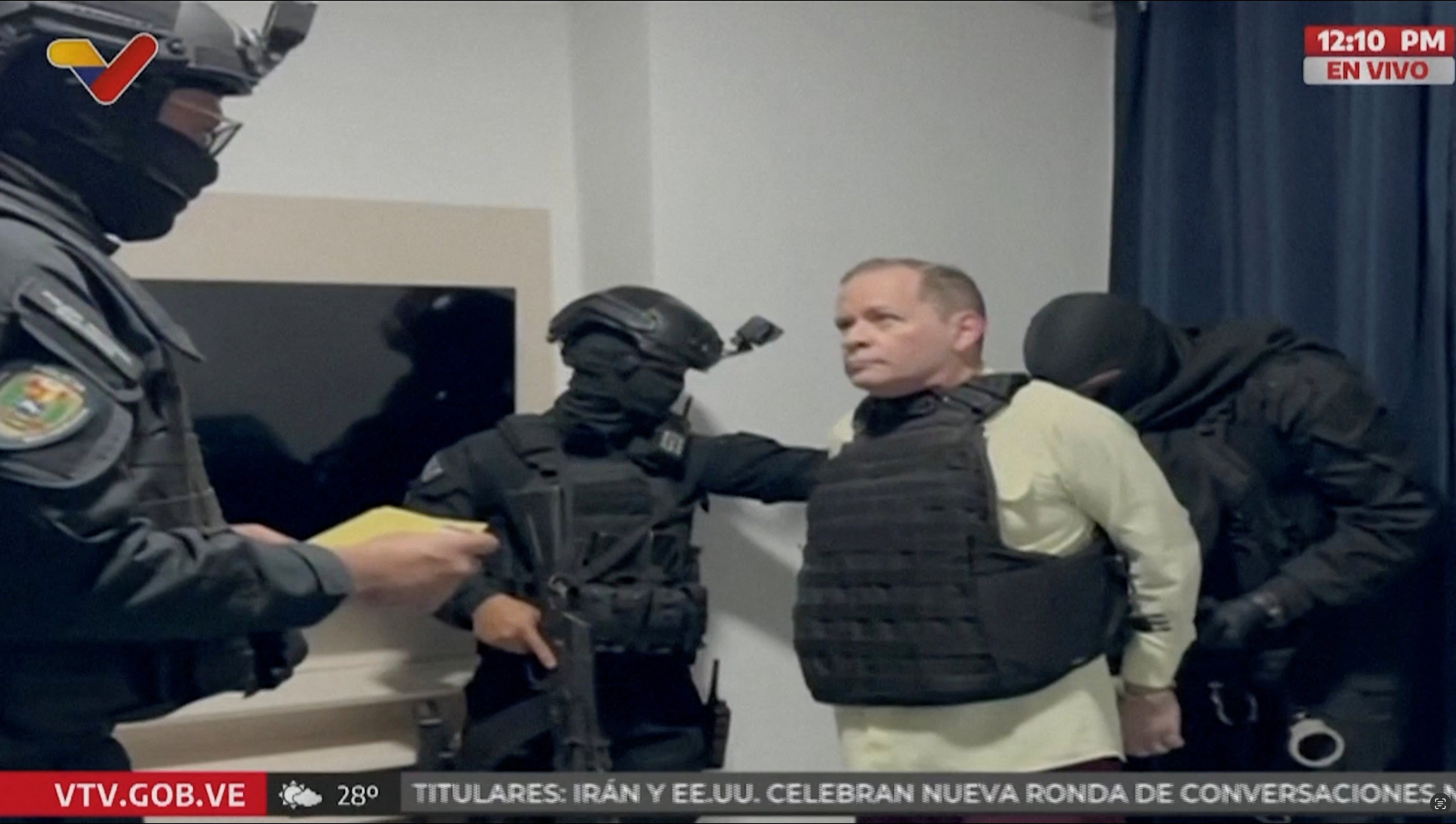 Venezuela opposition leader Juan Pablo Guanipa, wearing a bulletproof vest, is  handcuffed, after being detained by Venezuelan law enforcement officers On Friday. Photo: Venezualan Government TC/Reuters on May 23, 2025.