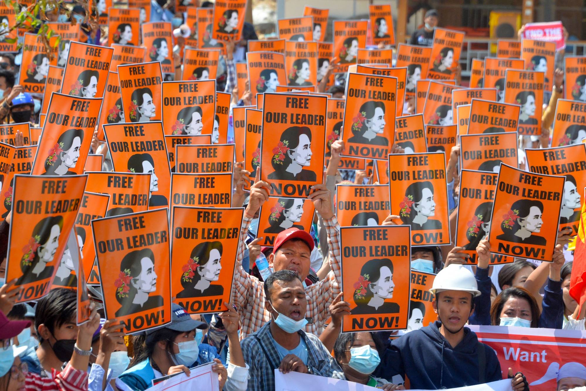 Protesters hold posters with the image of detained civilian leader Aung San Suu Kyi during a demonstration against the military coup in Naypyidaw, Myanmar on February 28, 2021. Photo: AFP Protesters hold posters with the image of detained civilian leader Aung San Suu Kyi during a demonstration against the military coup in Naypyidaw, Myanmar on February 28, 2021. Photo: AFP