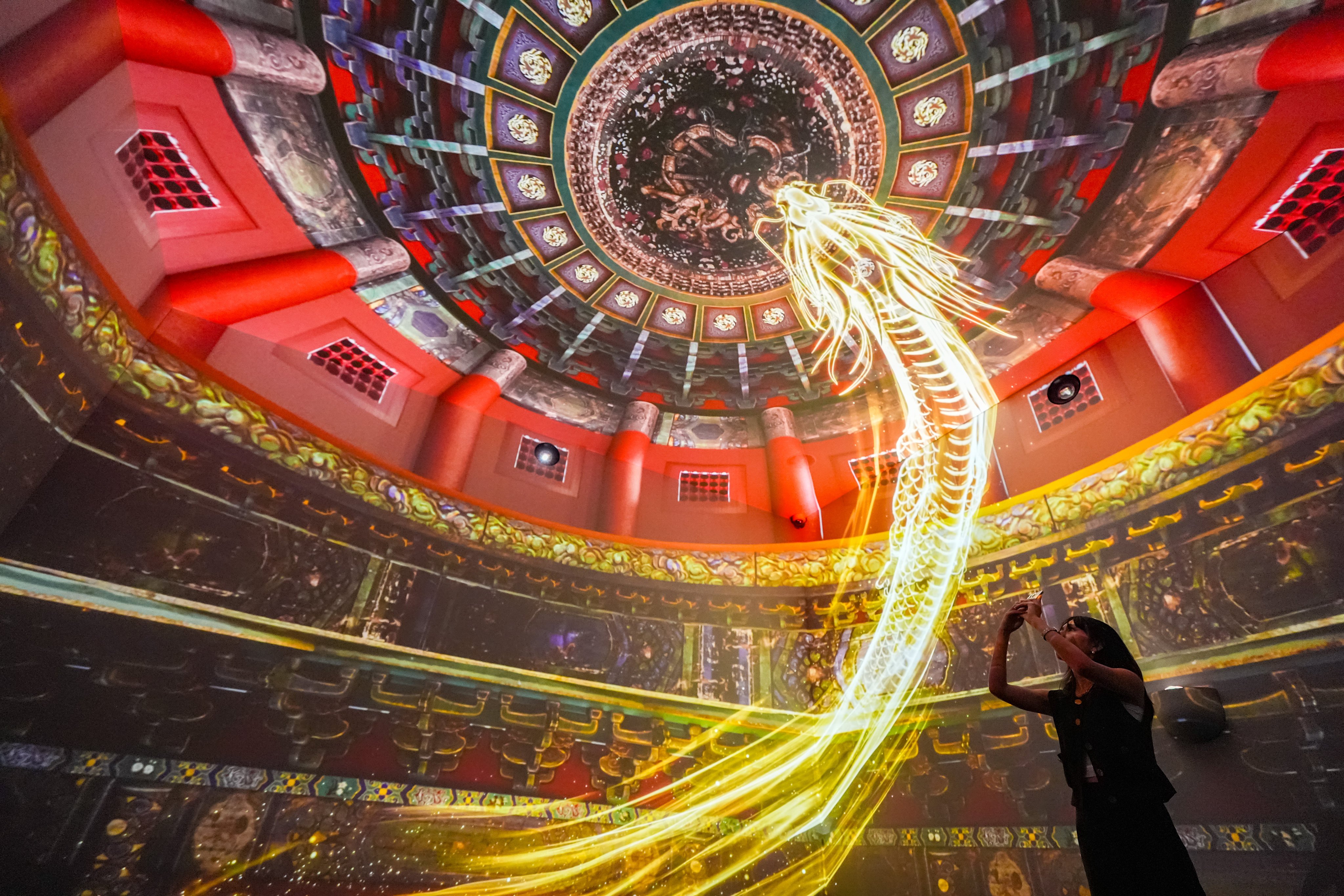 Visitors at the Hong Kong exhibition can enjoy moving images of dragons, phoenixes and other icons associated with the Forbidden City. Photo: Eugene Lee