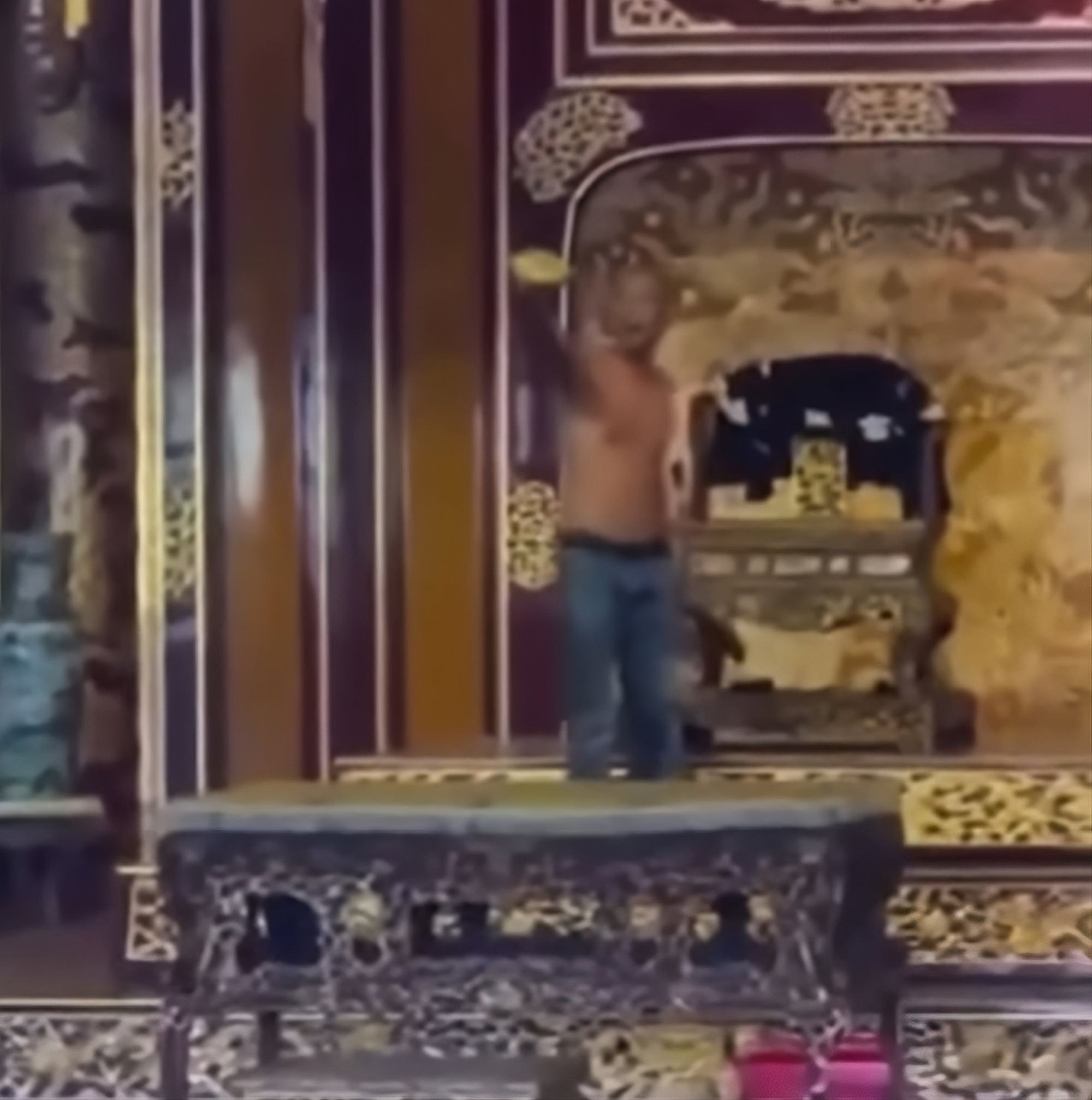 A still image from a video circulated on social media shows a shirtless man in the throne room of Hue city’s Thai Hoa Palace. Photo: Facebook/MaiThanhMai A still image from a video circulated on social media shows a shirtless man in the throne room of Hue city’s Thai Hoa Palace. Photo: Facebook/MaiThanhMai