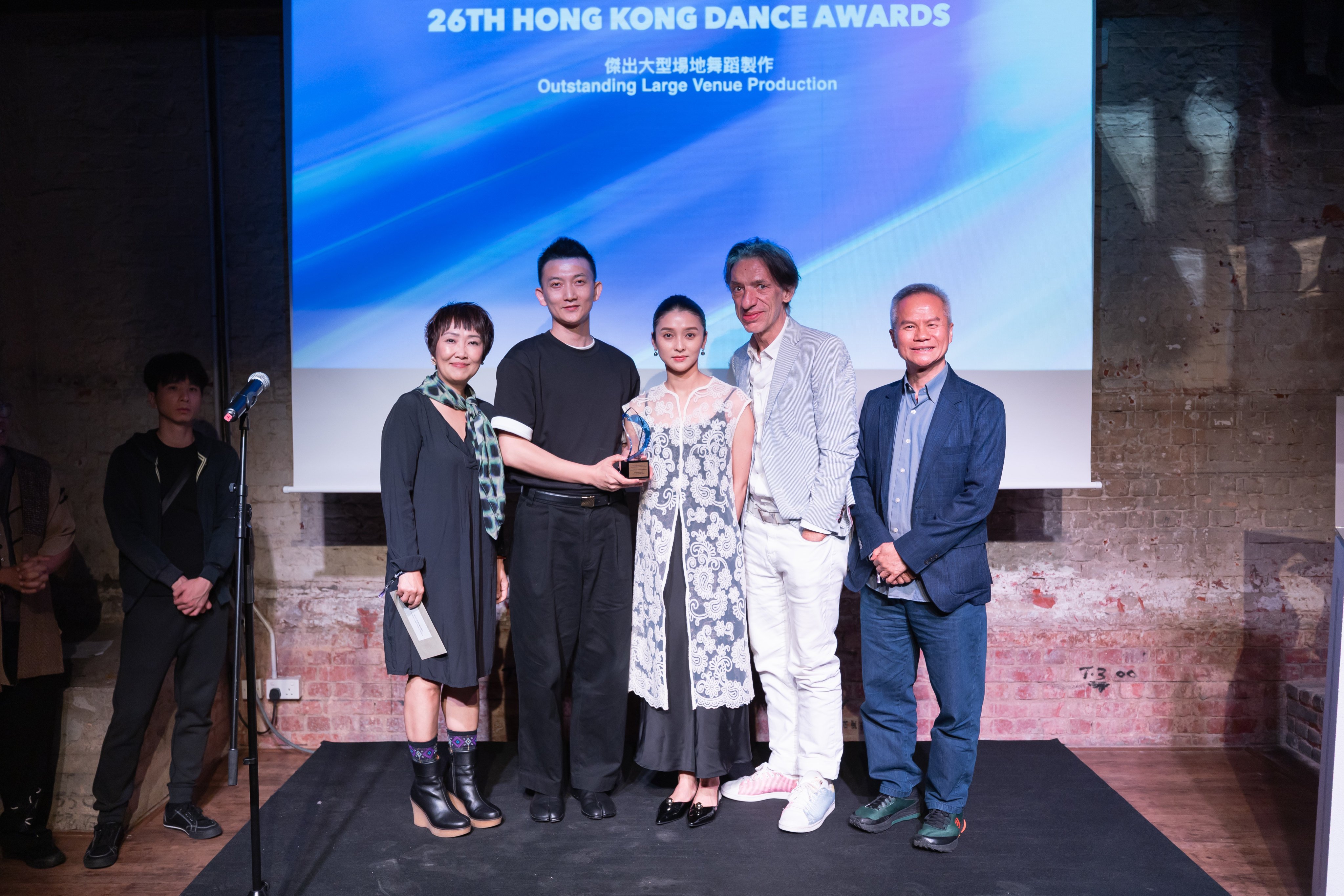 Hong Kong Ballet’s Ricky Hu Songwei (second from left), Ma Jingwen (centre) and Septime Webre (second from right) receive the 2025 Hong Kong Dance Awards prize for best choreography from Olivia Yan and Tang Shu-wing, one of six the company took home. Photo: Hong Kong Dance Alliance