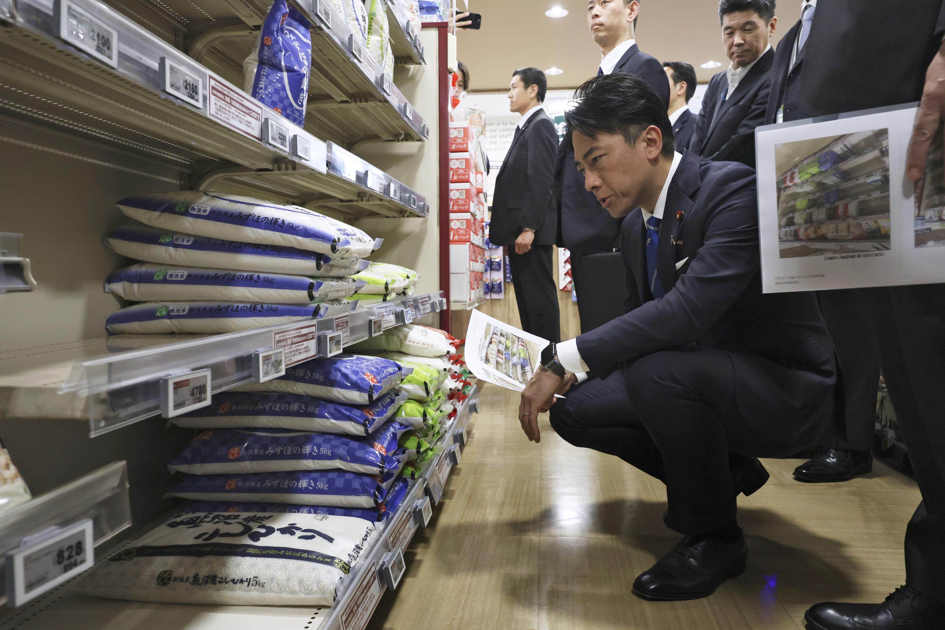 Japan’s new Agriculture, Forestry and Fisheries Minister Shinjiro Koizumi visits the rice section at a supermarket in Tokyo on Friday. Photo: Kyodo